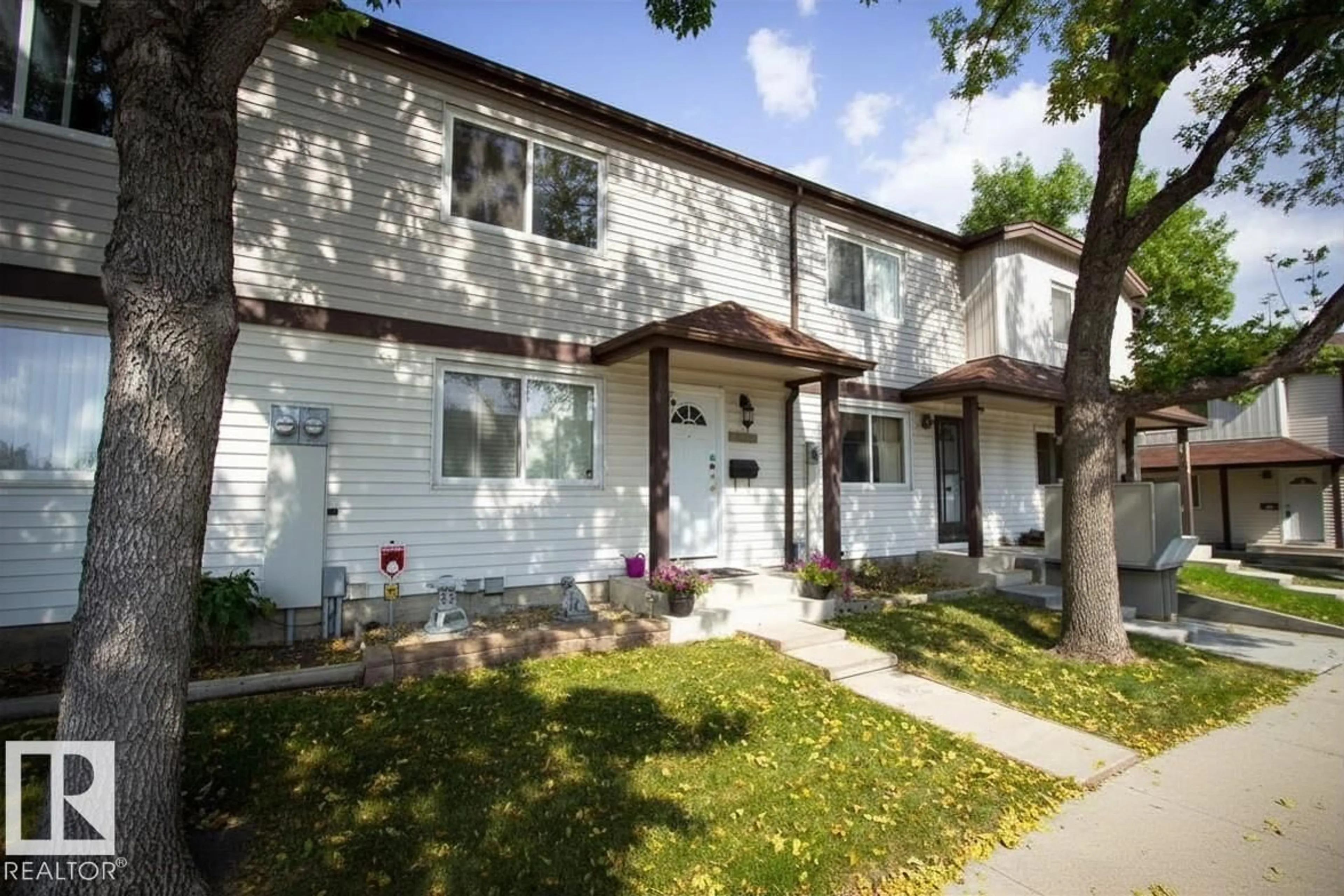 Home with vinyl exterior material, street for NW - 14648 54 ST, Edmonton Alberta T5A4L5