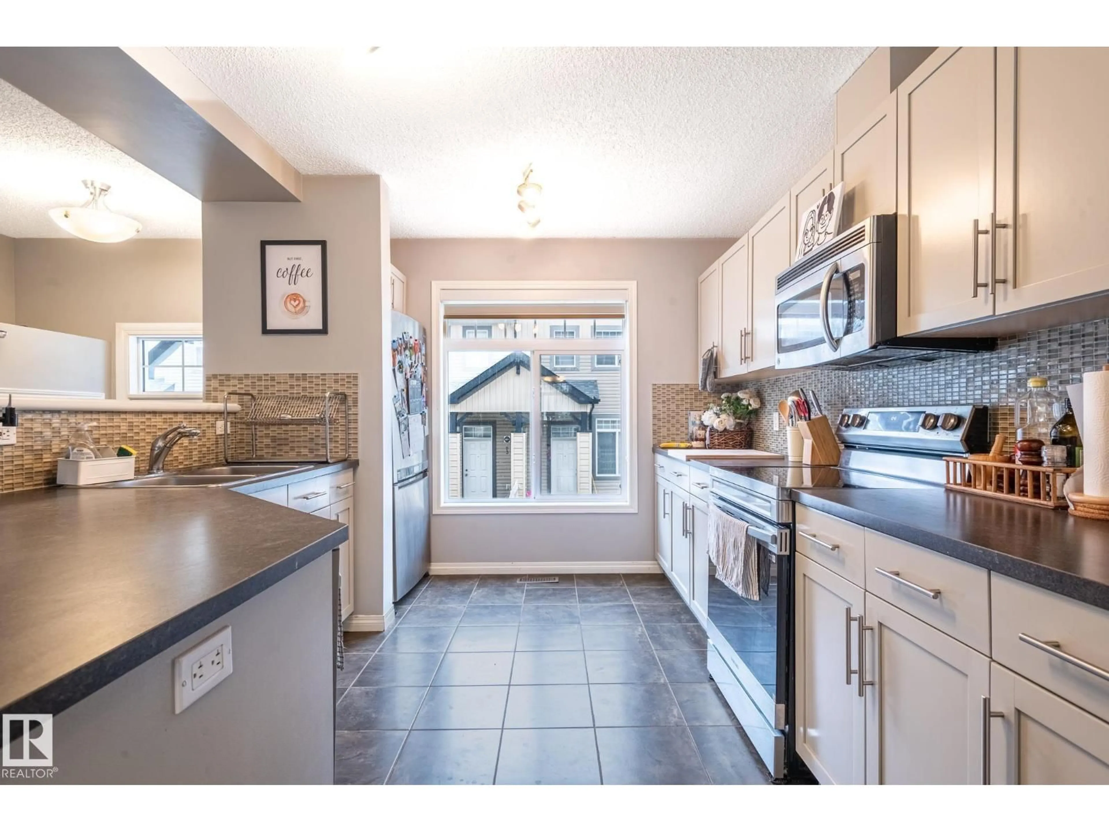 Open concept kitchen, ceramic/tile floor for #46 - 465 HEMINGWAY RD, Edmonton Alberta T6M0J7