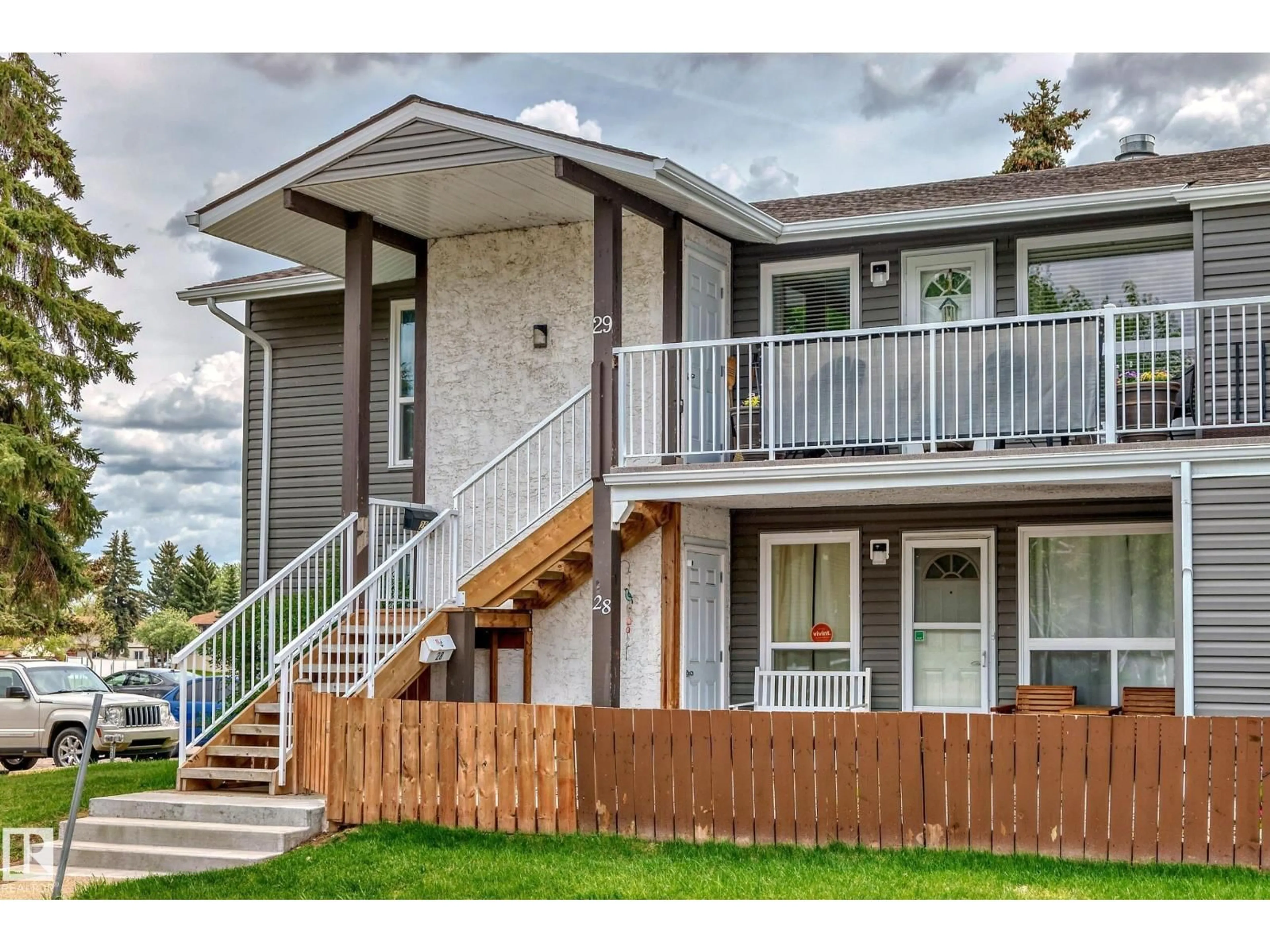 Home with vinyl exterior material, street for 28 - 3111 142 AV, Edmonton Alberta T5Y2H6