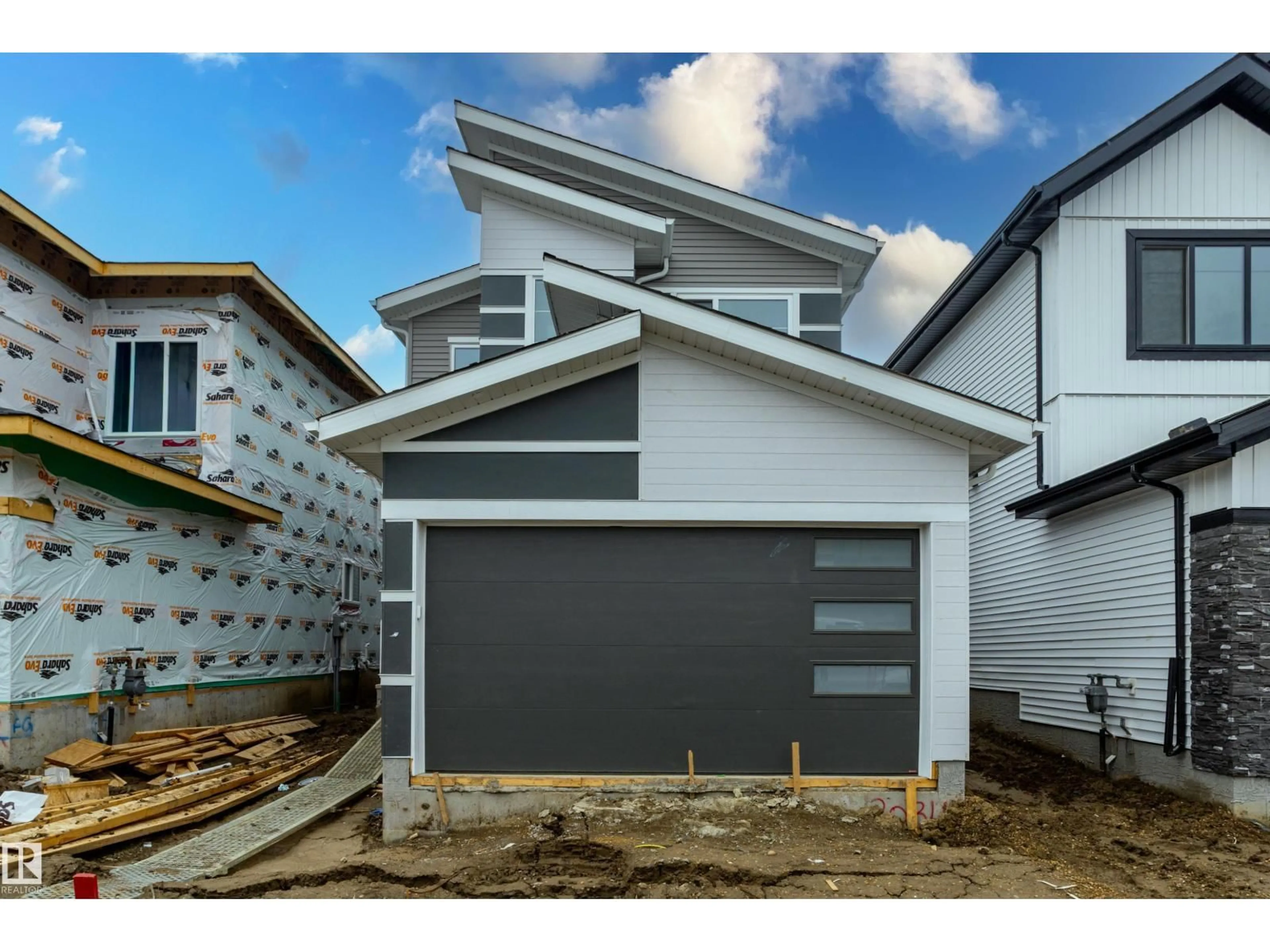 Home with vinyl exterior material, street for SW - 3034 7A AV, Edmonton Alberta T6X3M3