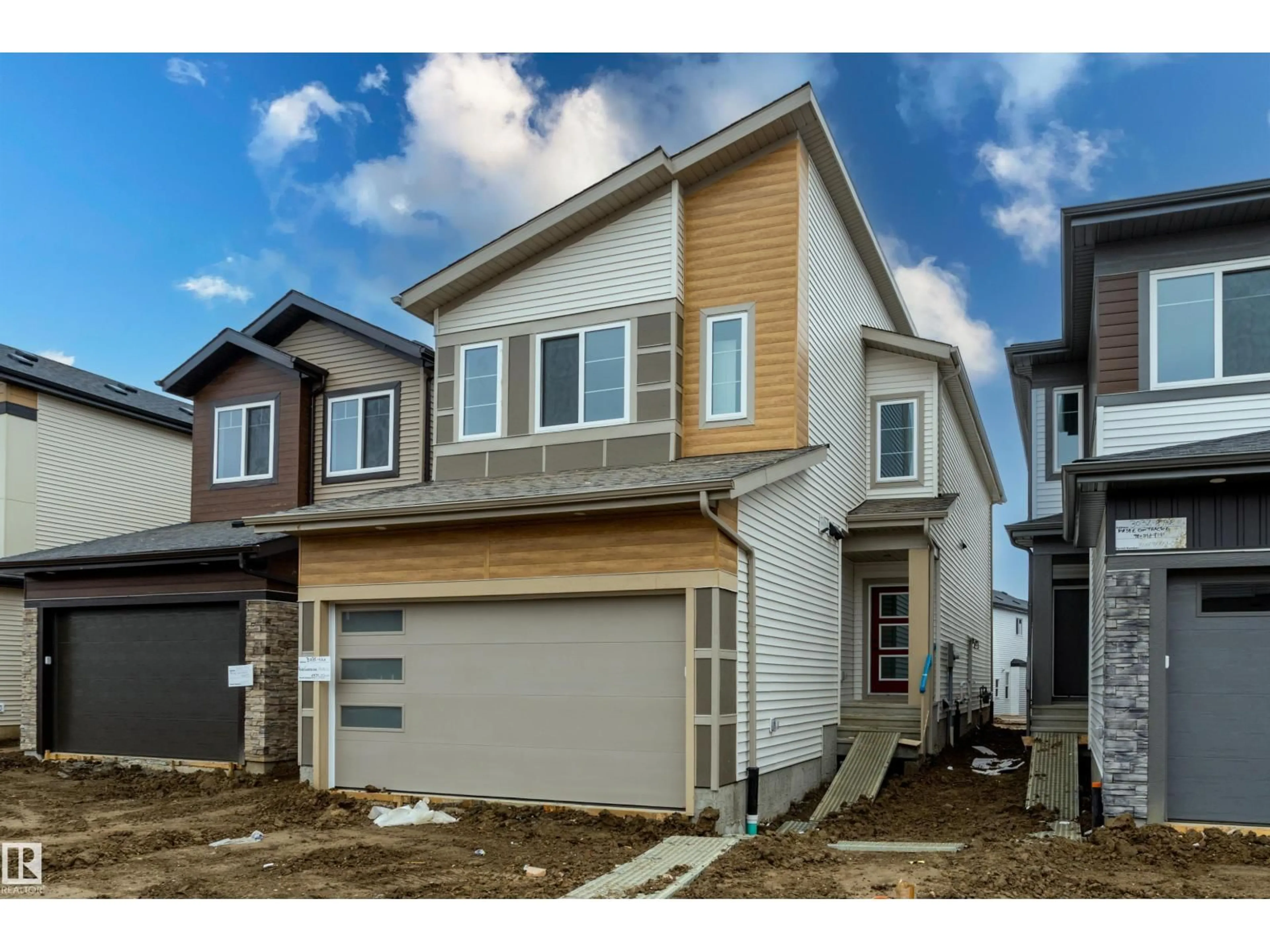 Home with vinyl exterior material, street for 3036 8 AV, Edmonton Alberta T6X3M6