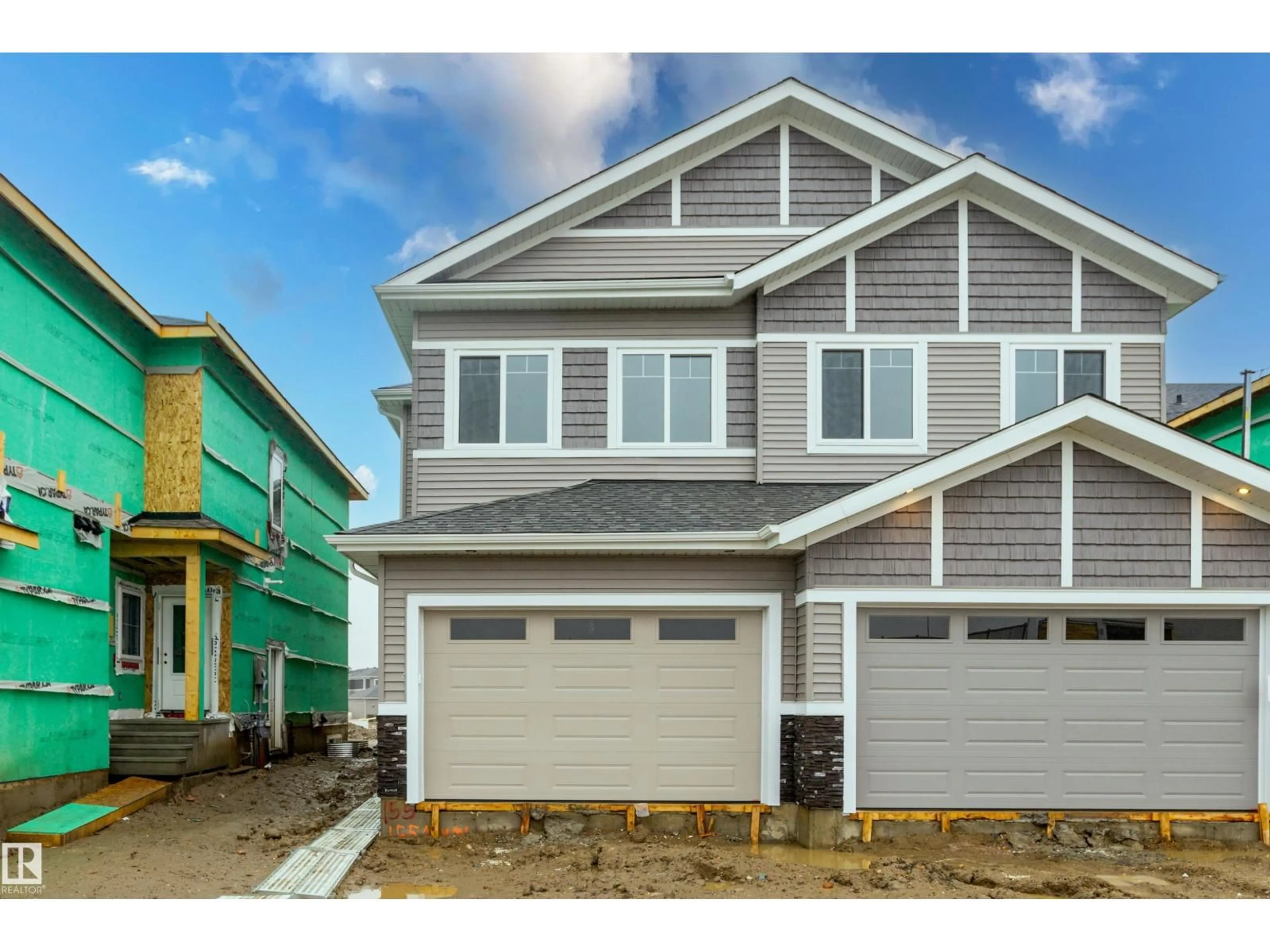 Home with vinyl exterior material, street for 155 MUNN WY, Leduc Alberta T9E1X9