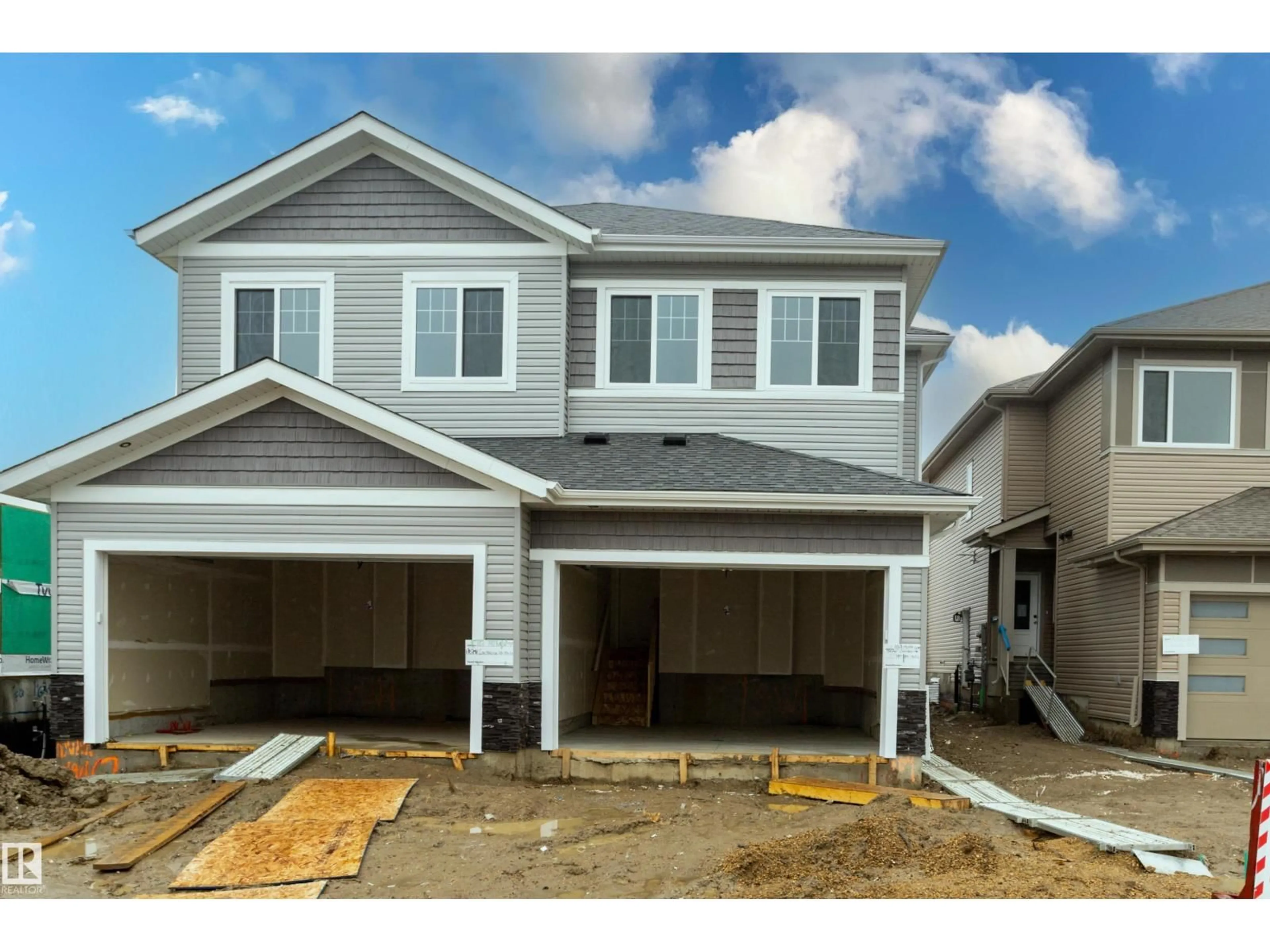 Home with vinyl exterior material, street for 169 MUNN WY, Leduc Alberta T9E1X9