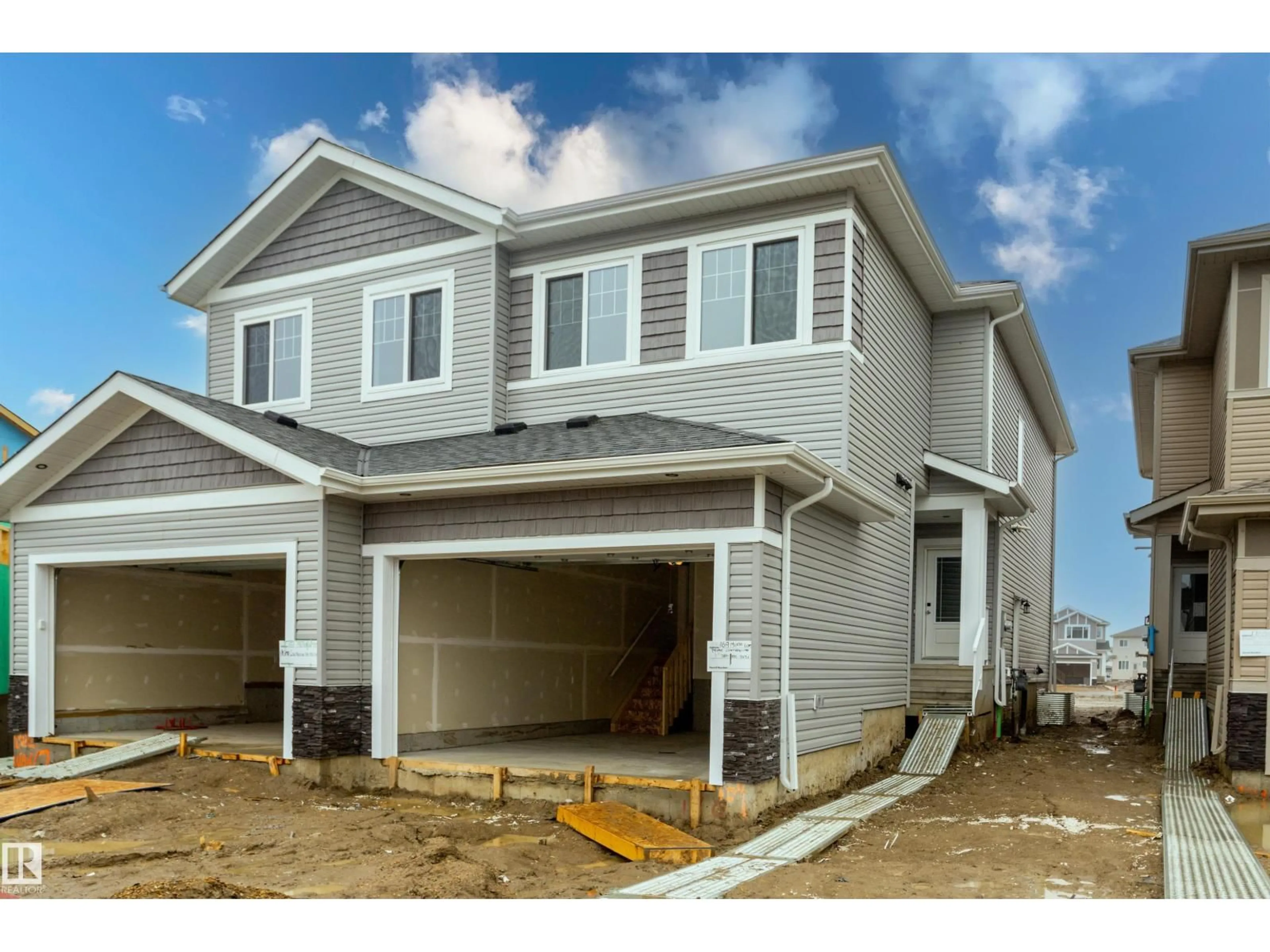 Home with vinyl exterior material, street for 169 MUNN WY, Leduc Alberta T9E1X9