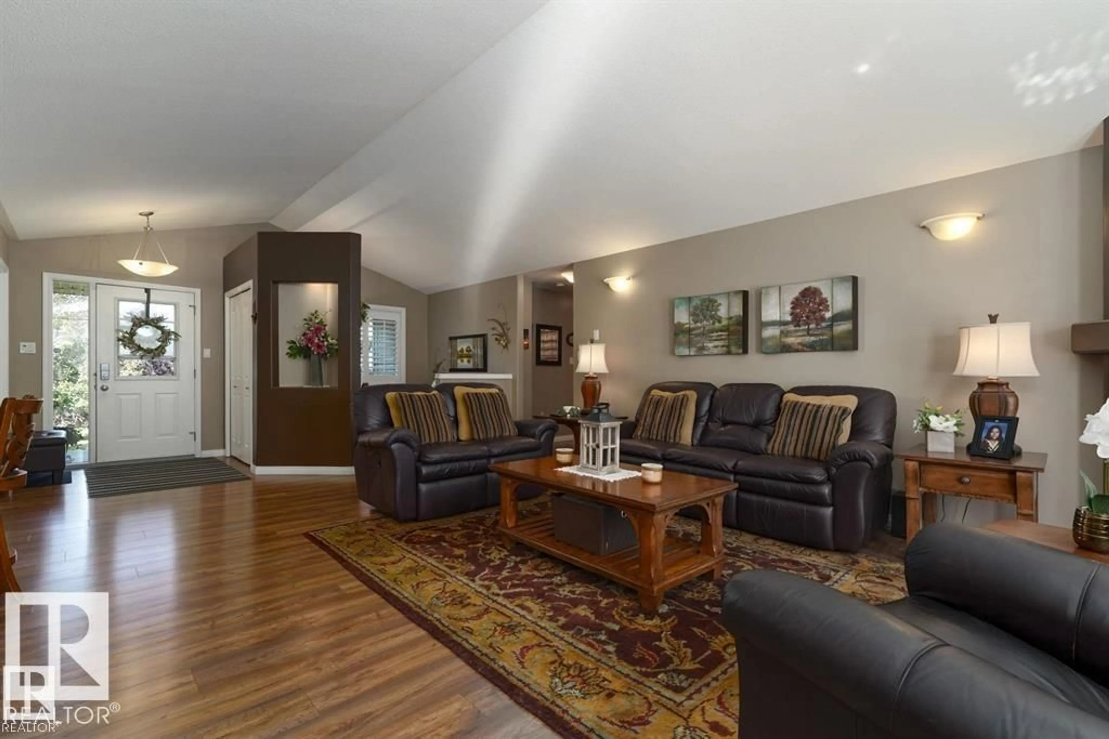 Living room with furniture, wood/laminate floor for 37 - 52001 RGE ROAD 275, Rural Parkland County Alberta T7X3V2