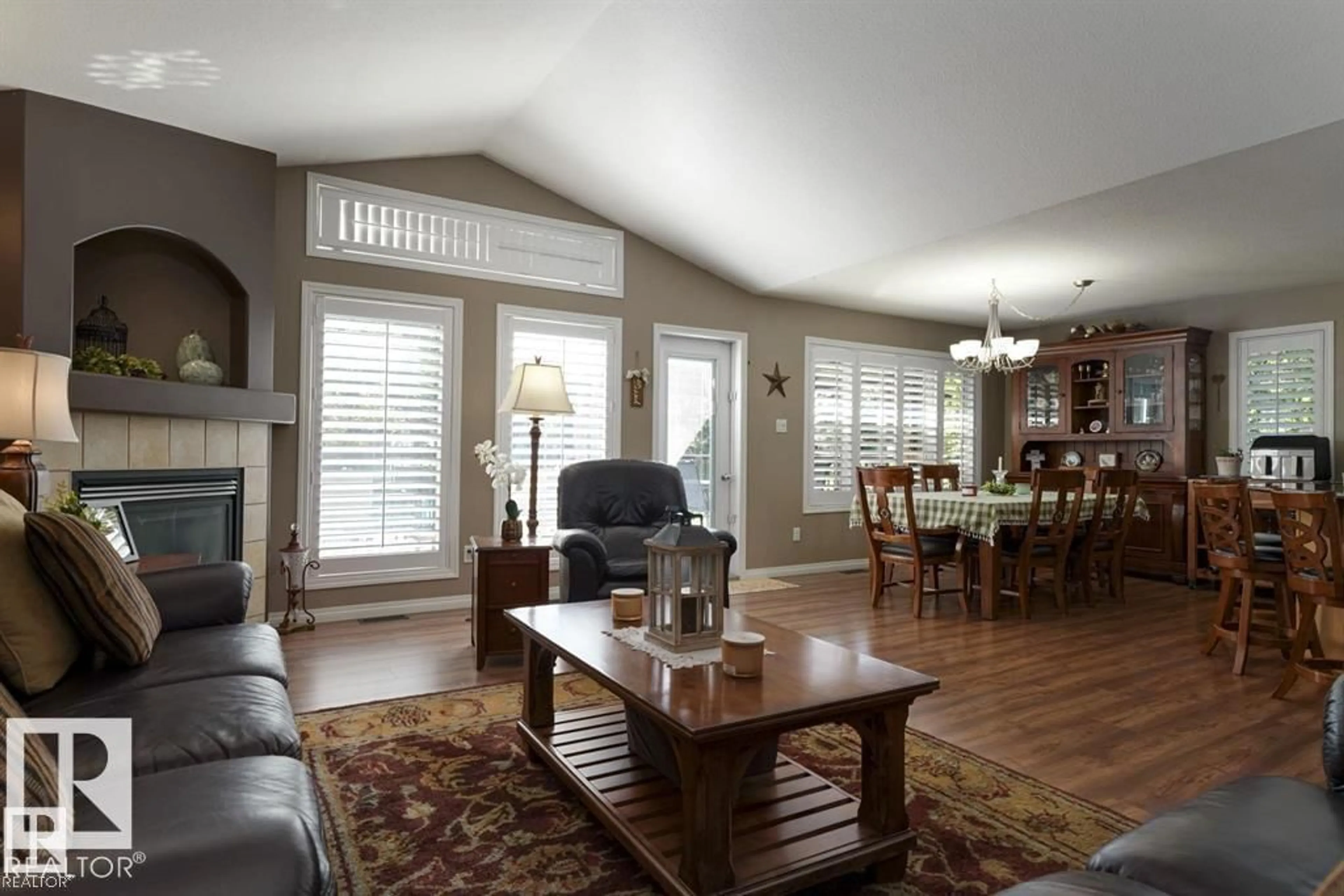 Living room with furniture, wood/laminate floor for 37 - 52001 RGE ROAD 275, Rural Parkland County Alberta T7X3V2