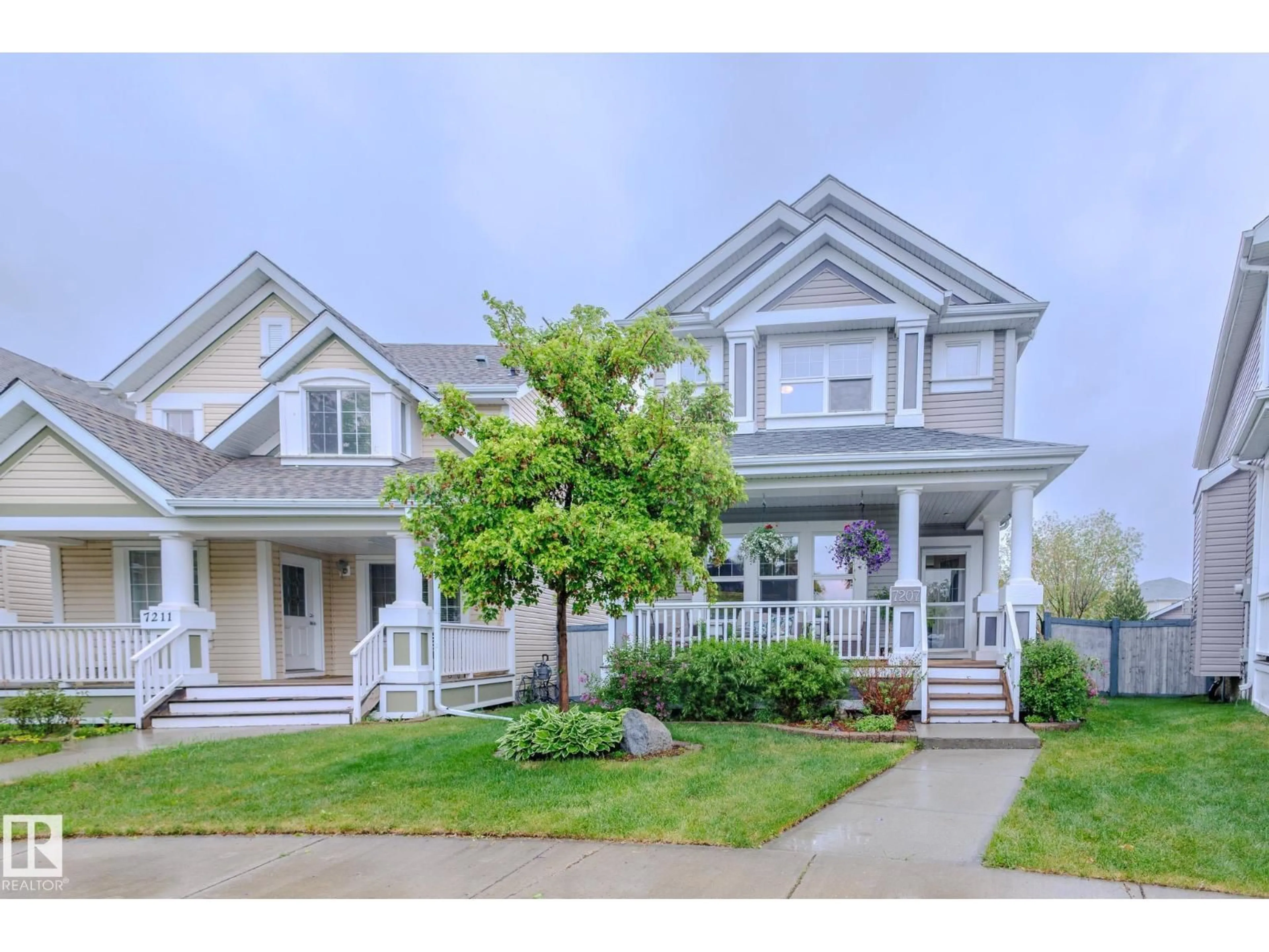 Home with vinyl exterior material, street for 7207 14A AV SW, Edmonton Alberta T6X0E1