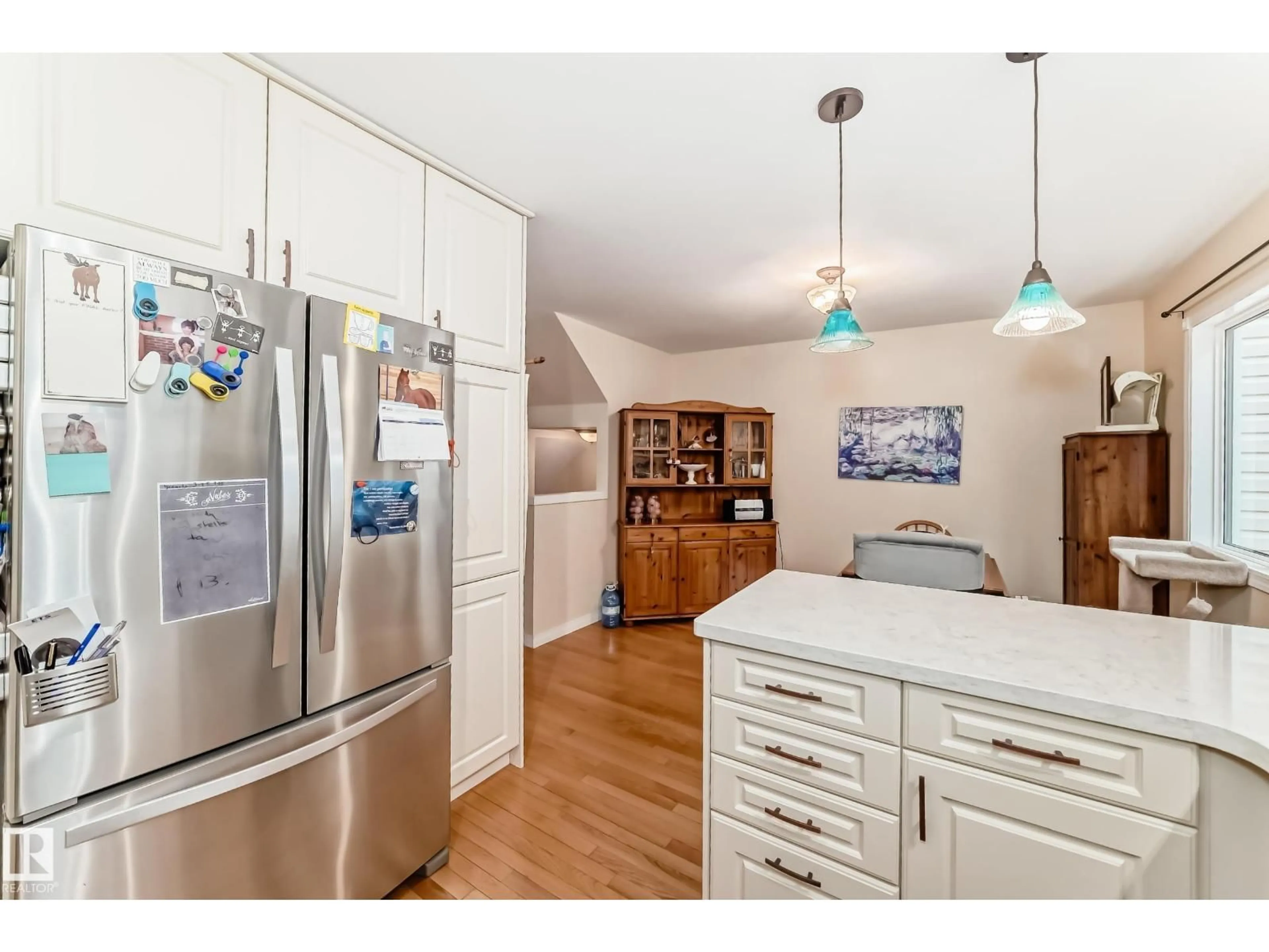 Open concept kitchen, wood/laminate floor for 11650 103 AV, Edmonton Alberta T5K0S6
