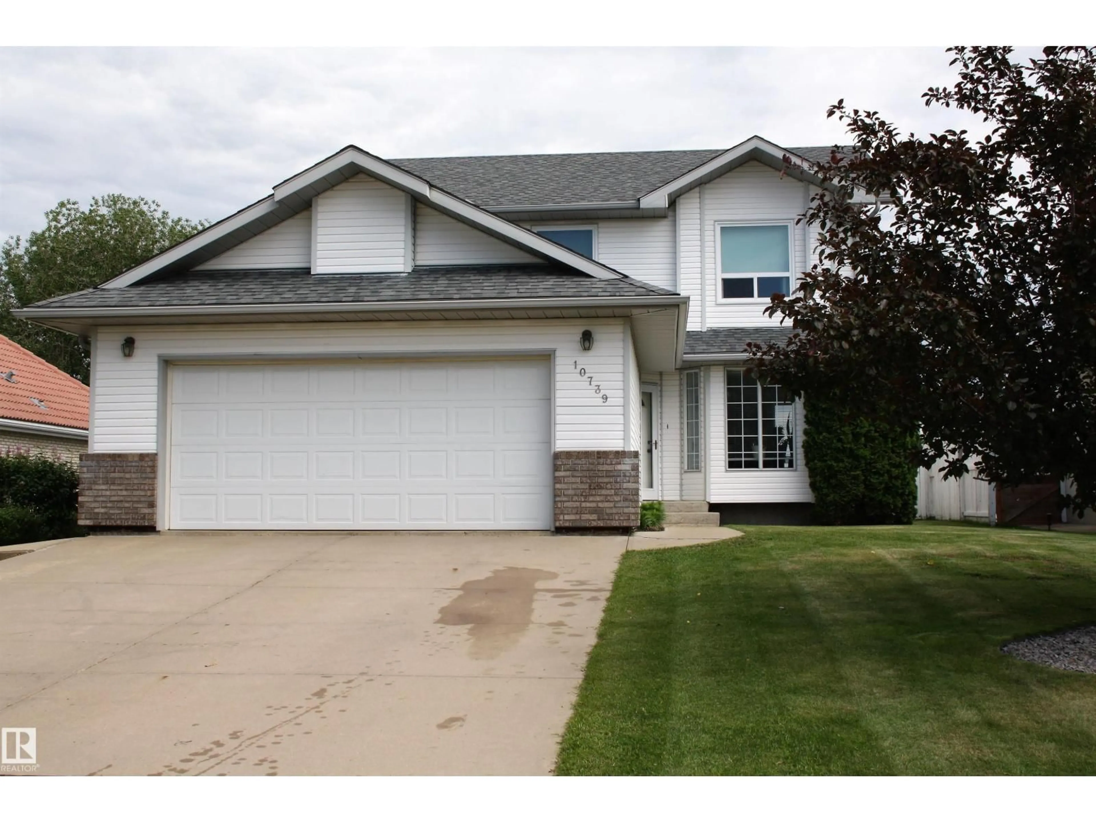 Home with vinyl exterior material, street for 10739 109 AV, Westlock Alberta T7P1B9