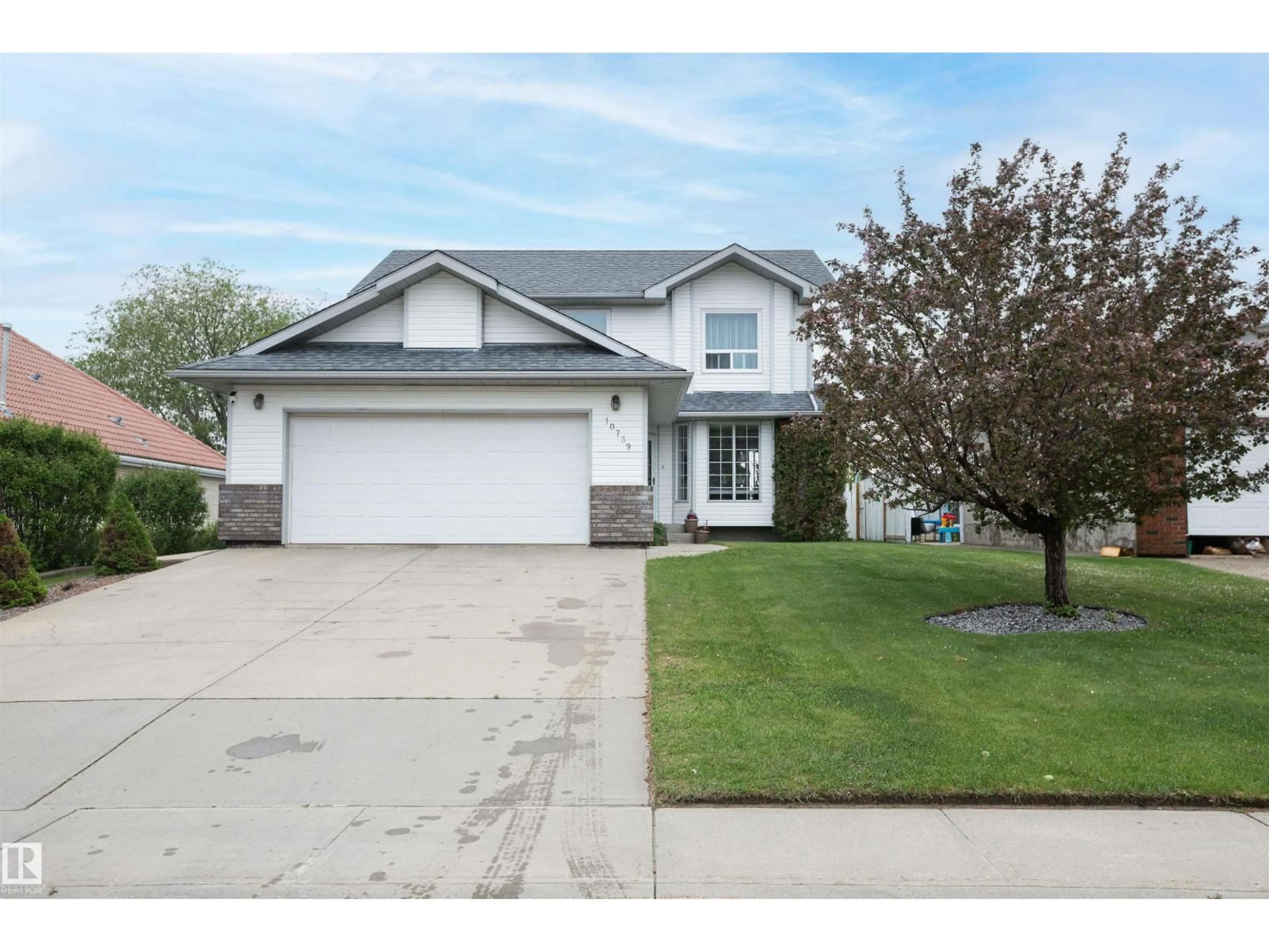Home with vinyl exterior material, street for 10739 109 AV, Westlock Alberta T7P1B9