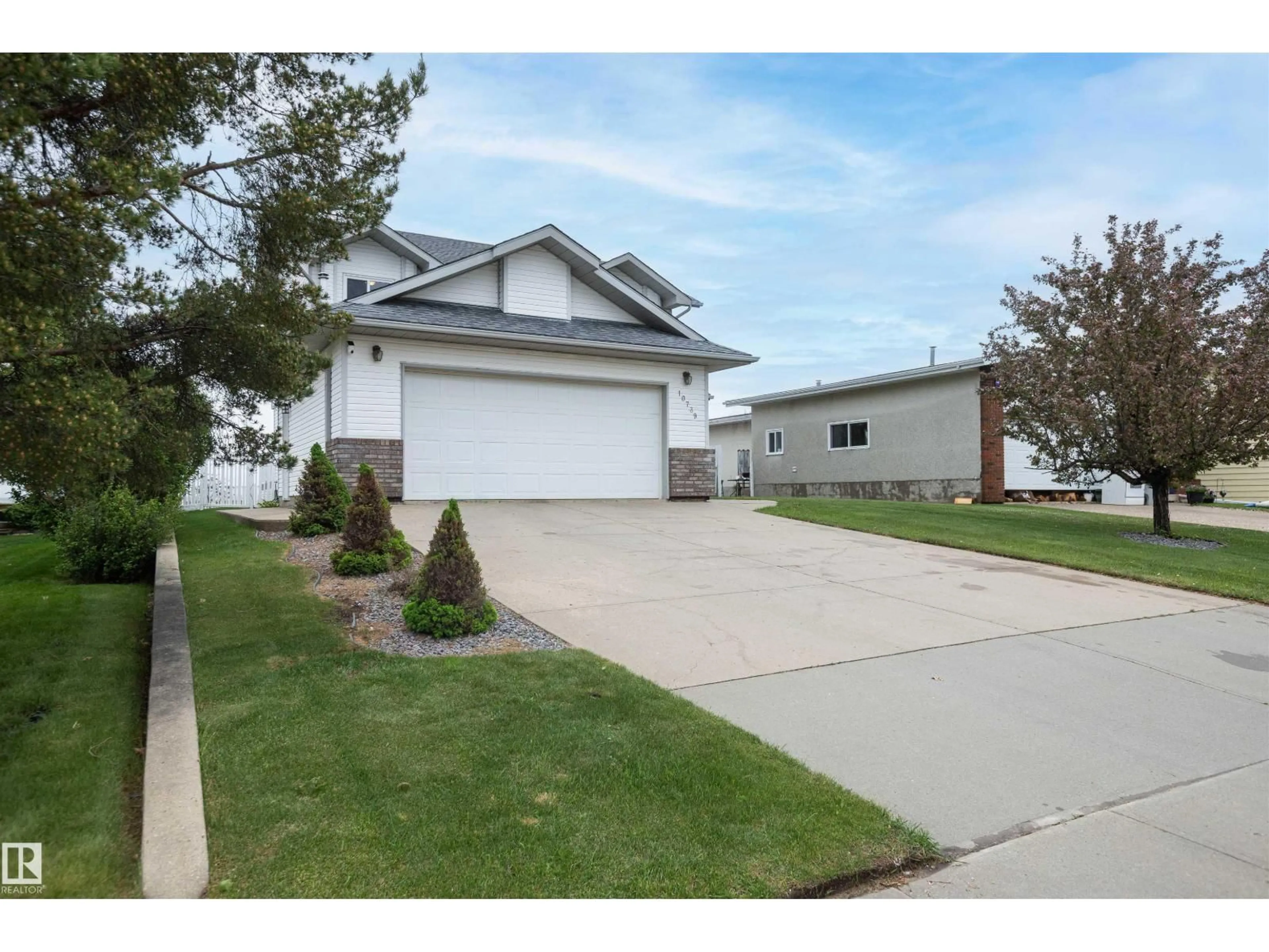 Home with vinyl exterior material, street for 10739 109 AV, Westlock Alberta T7P1B9
