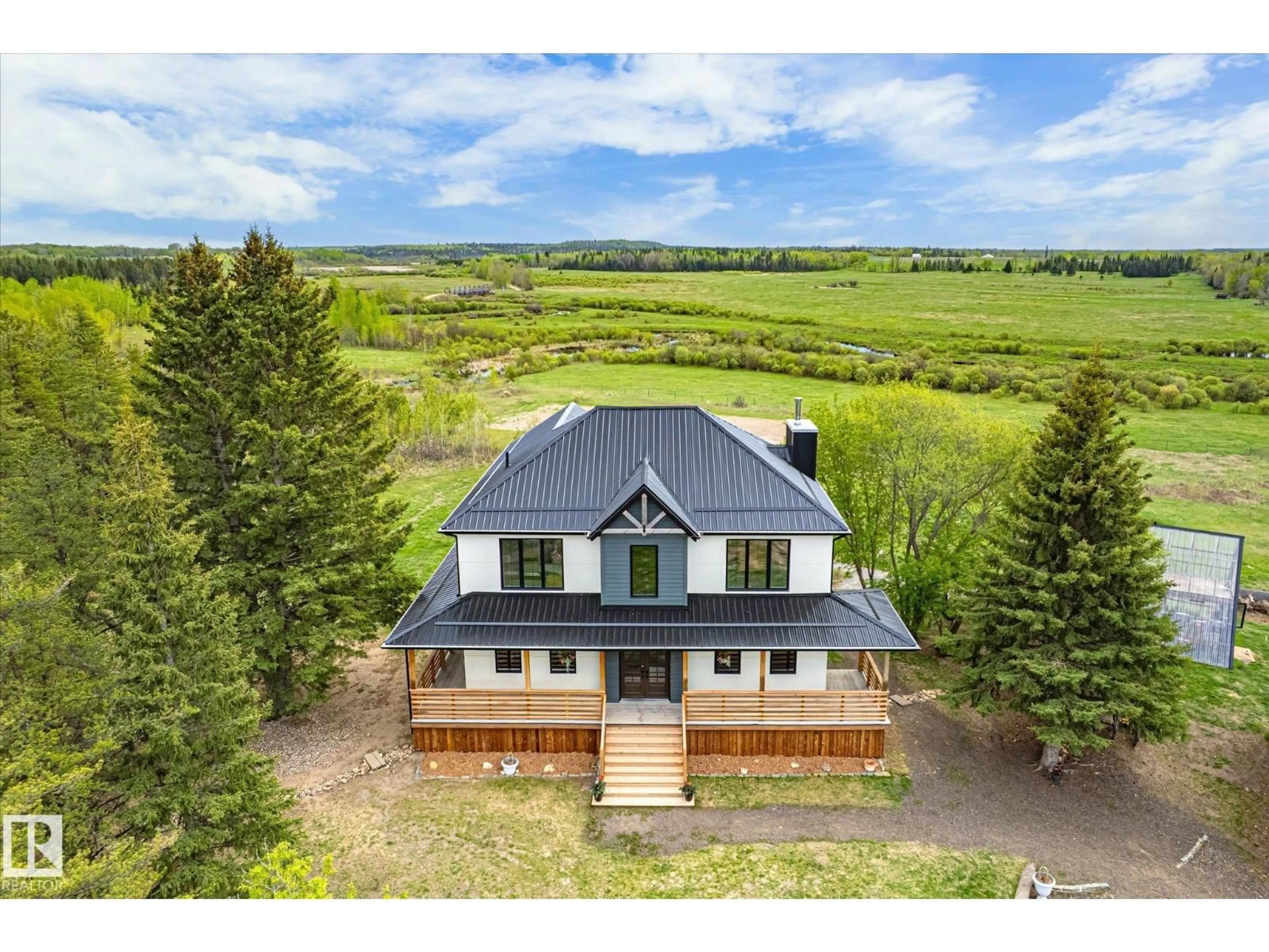 A pic from outside/outdoor area/front of a property/back of a property/a pic from drone, mountain view for 59102 RGE ROAD 234, Rural Westlock County Alberta T0G2J0