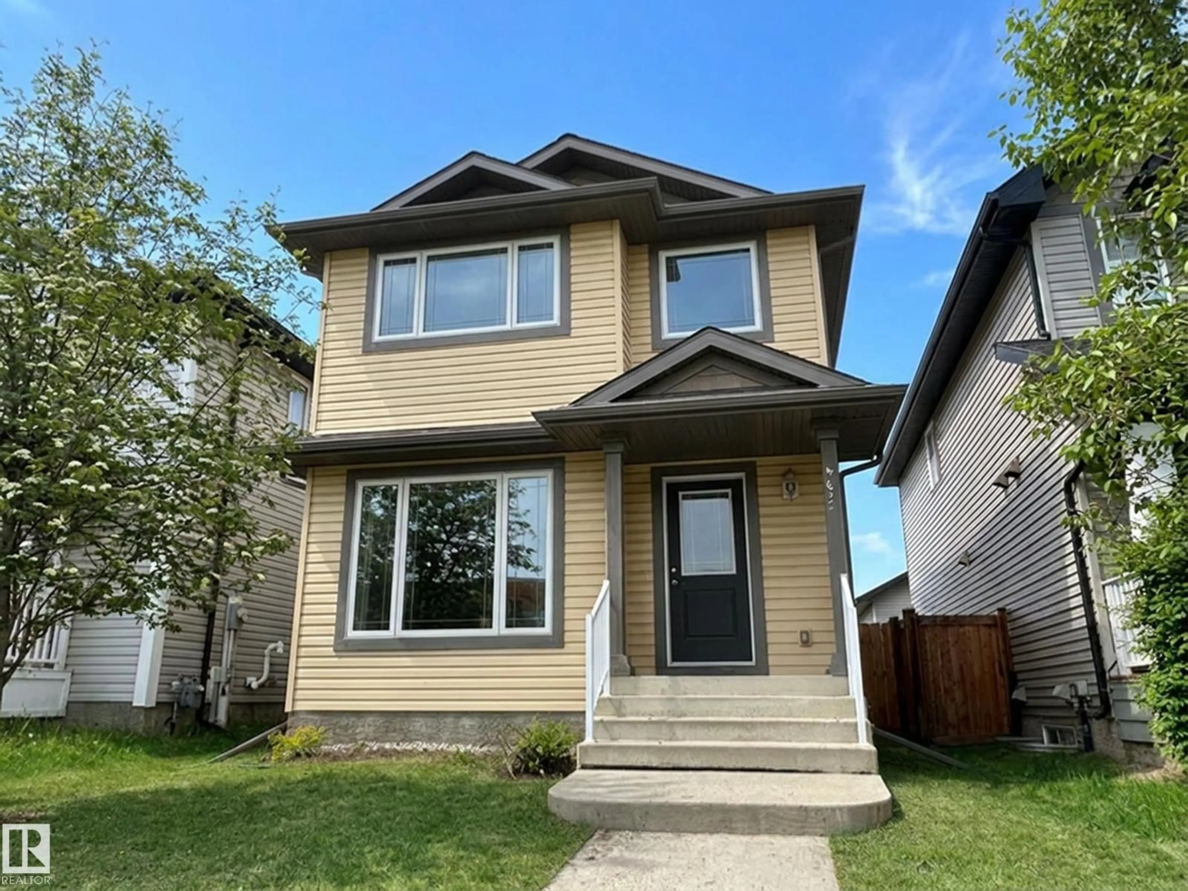 Home with vinyl exterior material, street for NW - 9432 211 ST, Edmonton Alberta T5T4R1