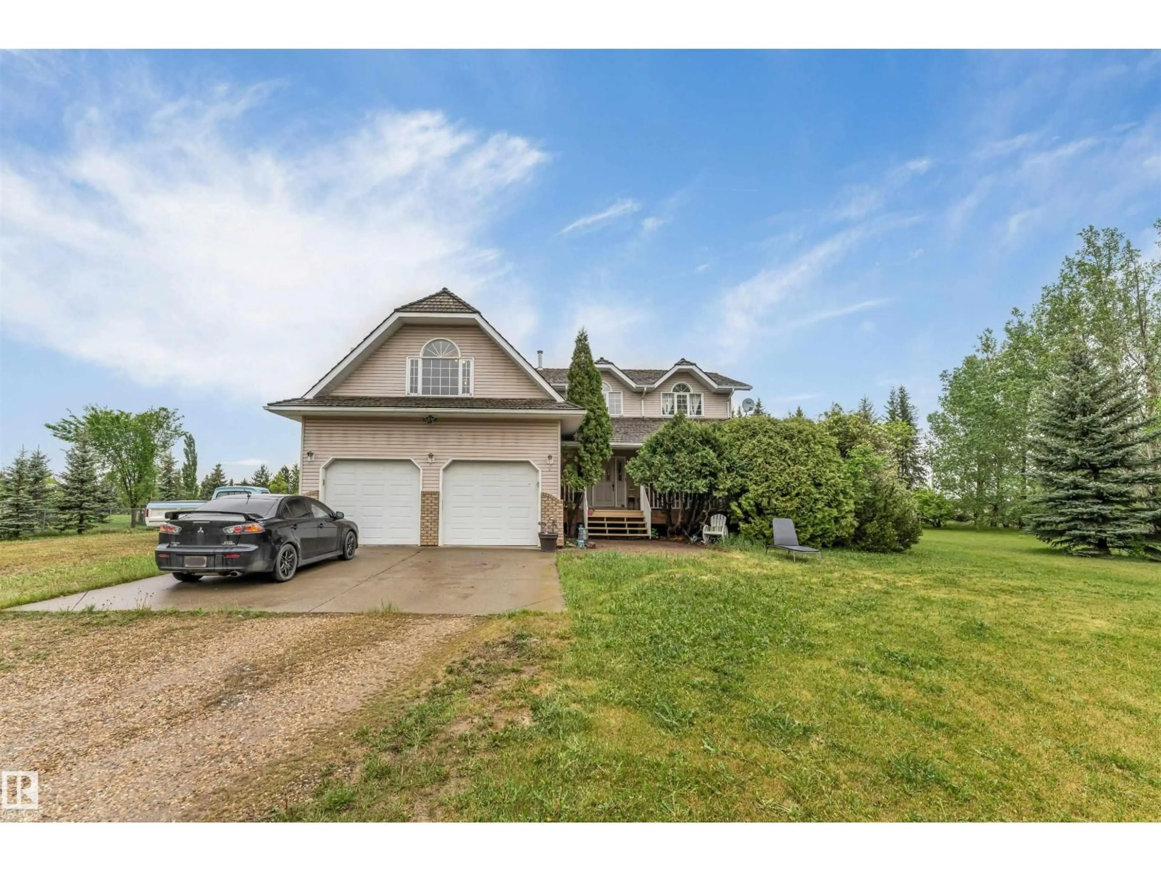 A pic from outside/outdoor area/front of a property/back of a property/a pic from drone, unknown for 390 50512 RGE RD 245, Rural Leduc County Alberta T6H4N6