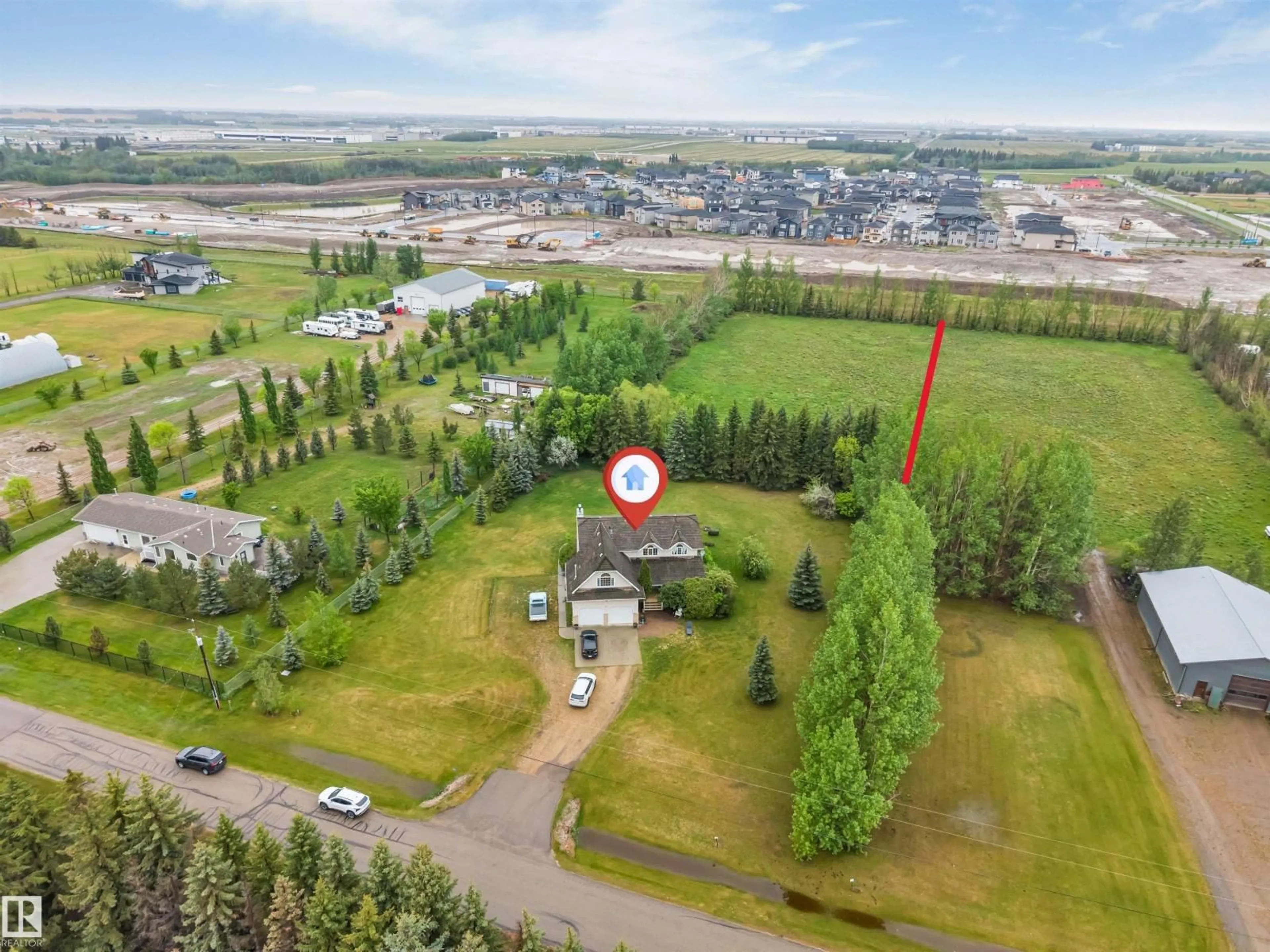 A pic from outside/outdoor area/front of a property/back of a property/a pic from drone, mountain view for 390 50512 RGE RD 245, Rural Leduc County Alberta T6H4N6