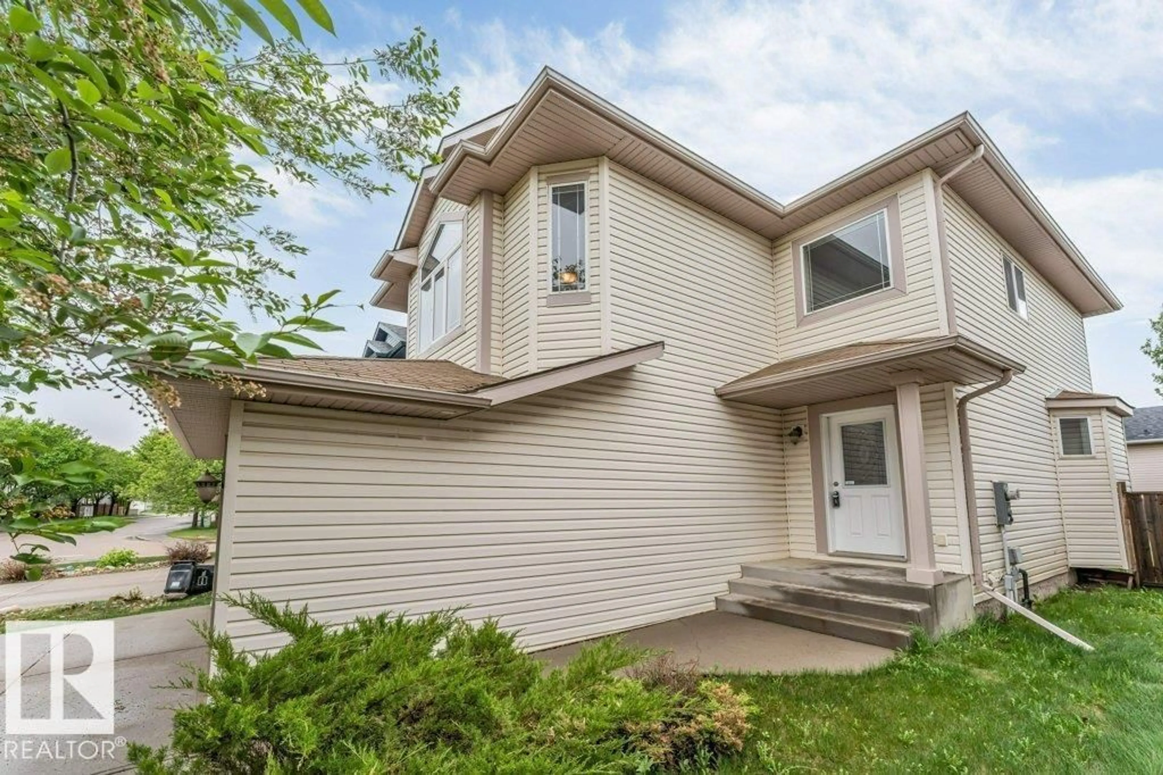 Home with vinyl exterior material, street for 16315 55 ST, Edmonton Alberta T5Y3K9