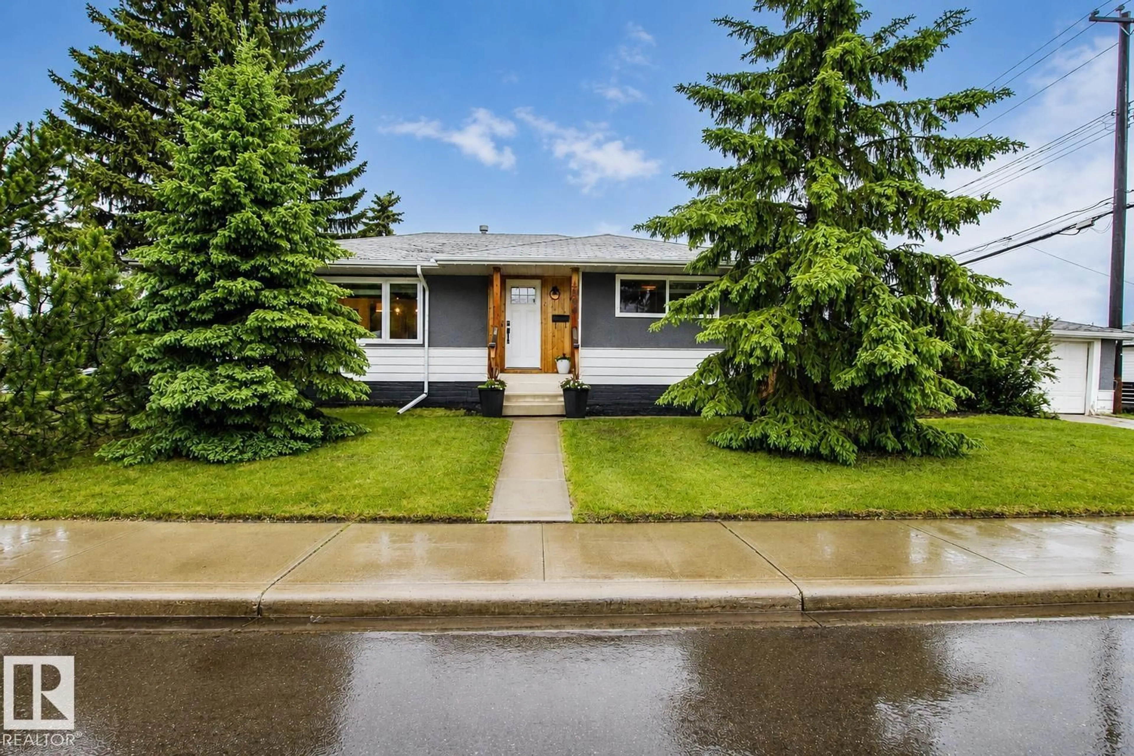 Home with vinyl exterior material, street for 4904 103 AV NW, Edmonton Alberta T6A0S9