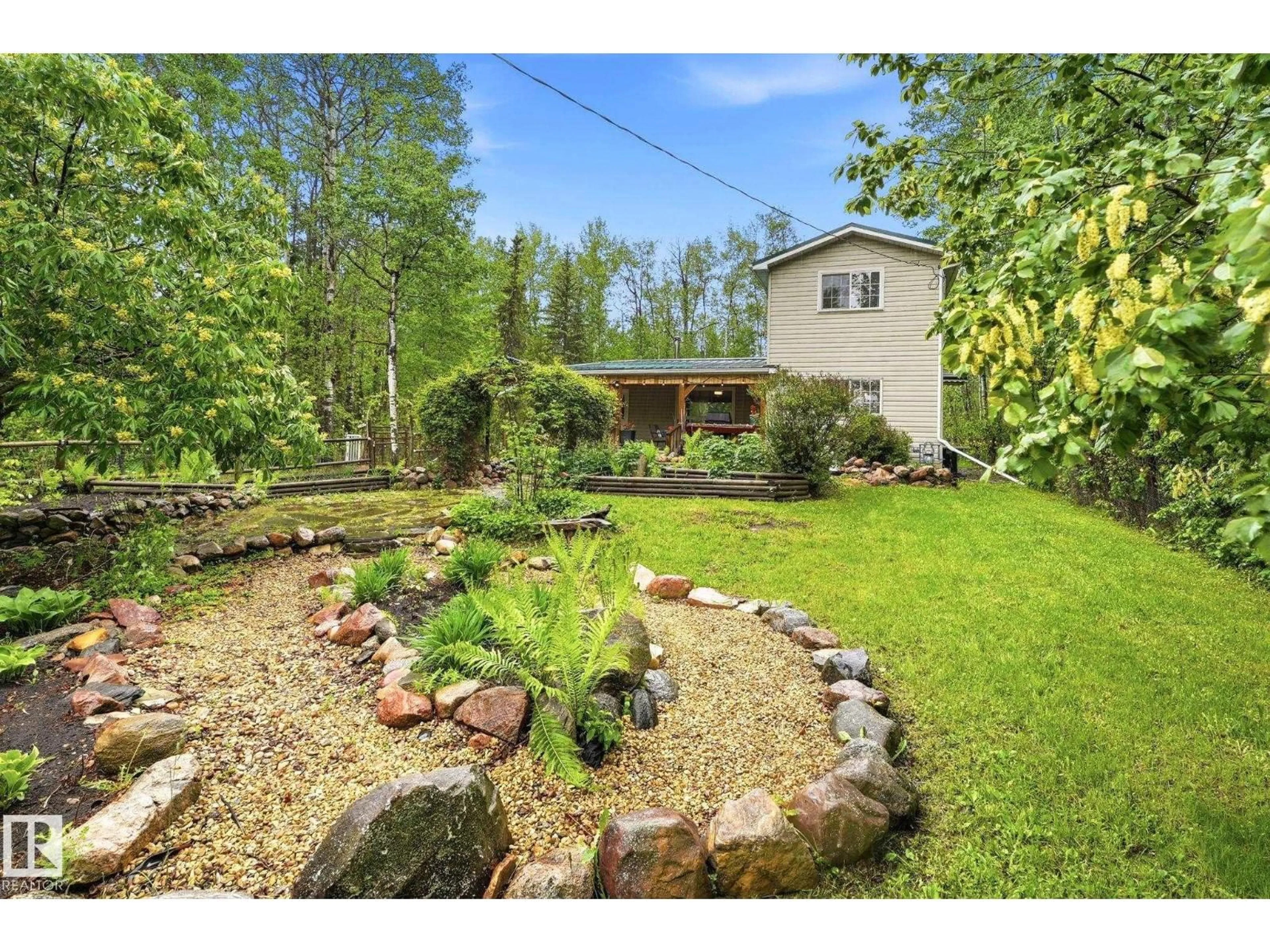 A pic from outside/outdoor area/front of a property/back of a property/a pic from drone, water/lake/river/ocean view for 322 - 57230 RANGE ROAD 25, Rural Barrhead County Alberta T0E1A0