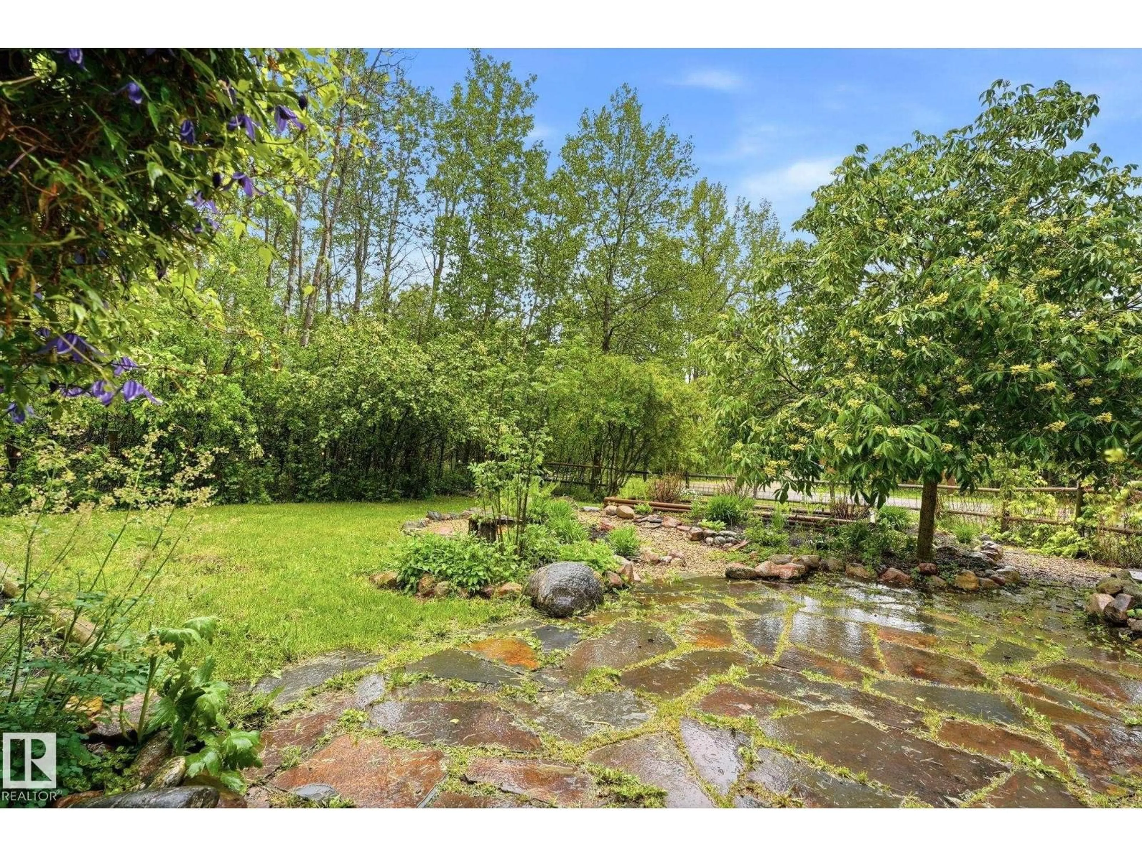 A pic from outside/outdoor area/front of a property/back of a property/a pic from drone, forest/trees view for 322 - 57230 RANGE ROAD 25, Rural Barrhead County Alberta T0E1A0