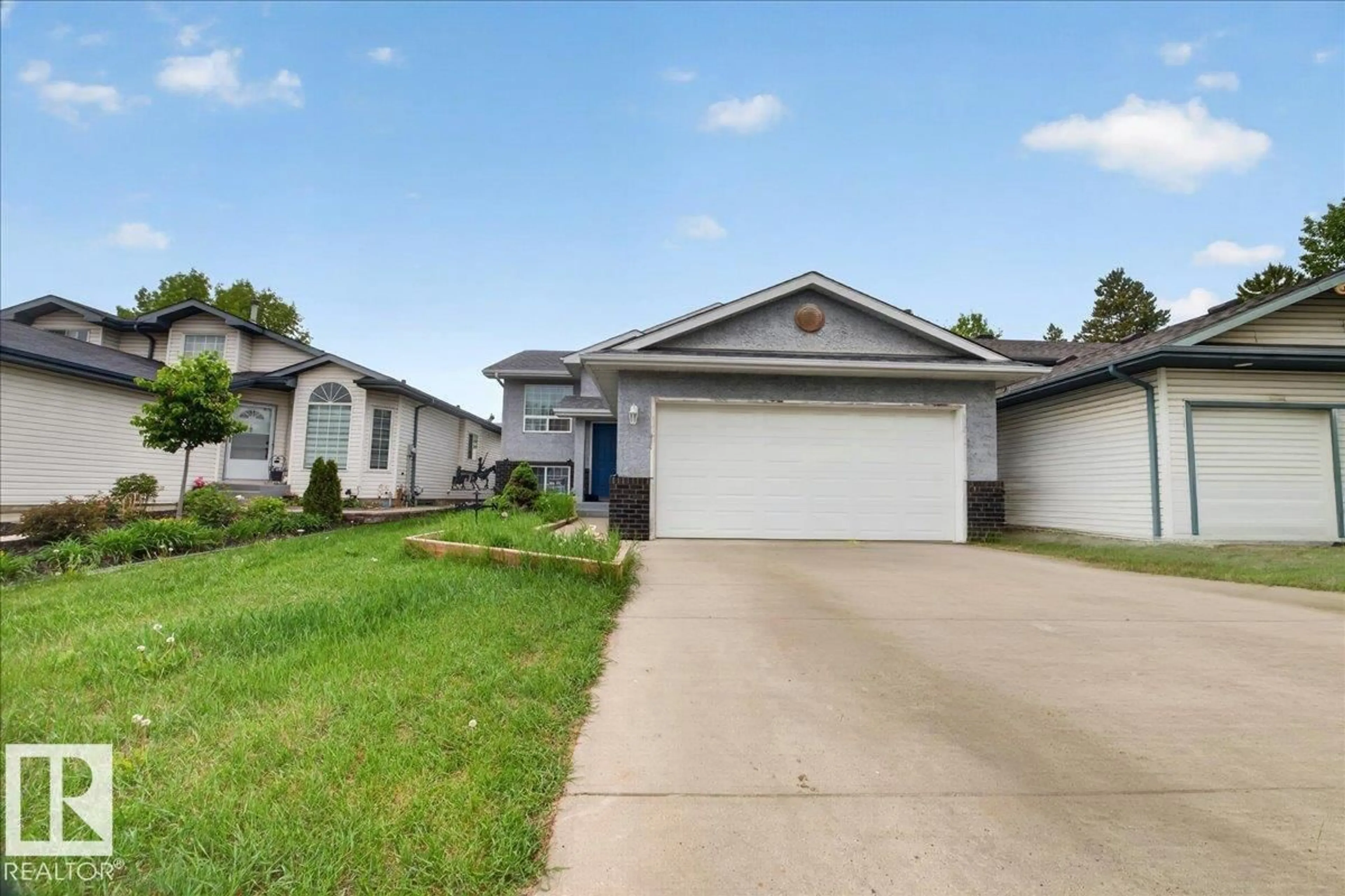 Home with vinyl exterior material, street for 5108 138A AV, Edmonton Alberta T5A4Z6