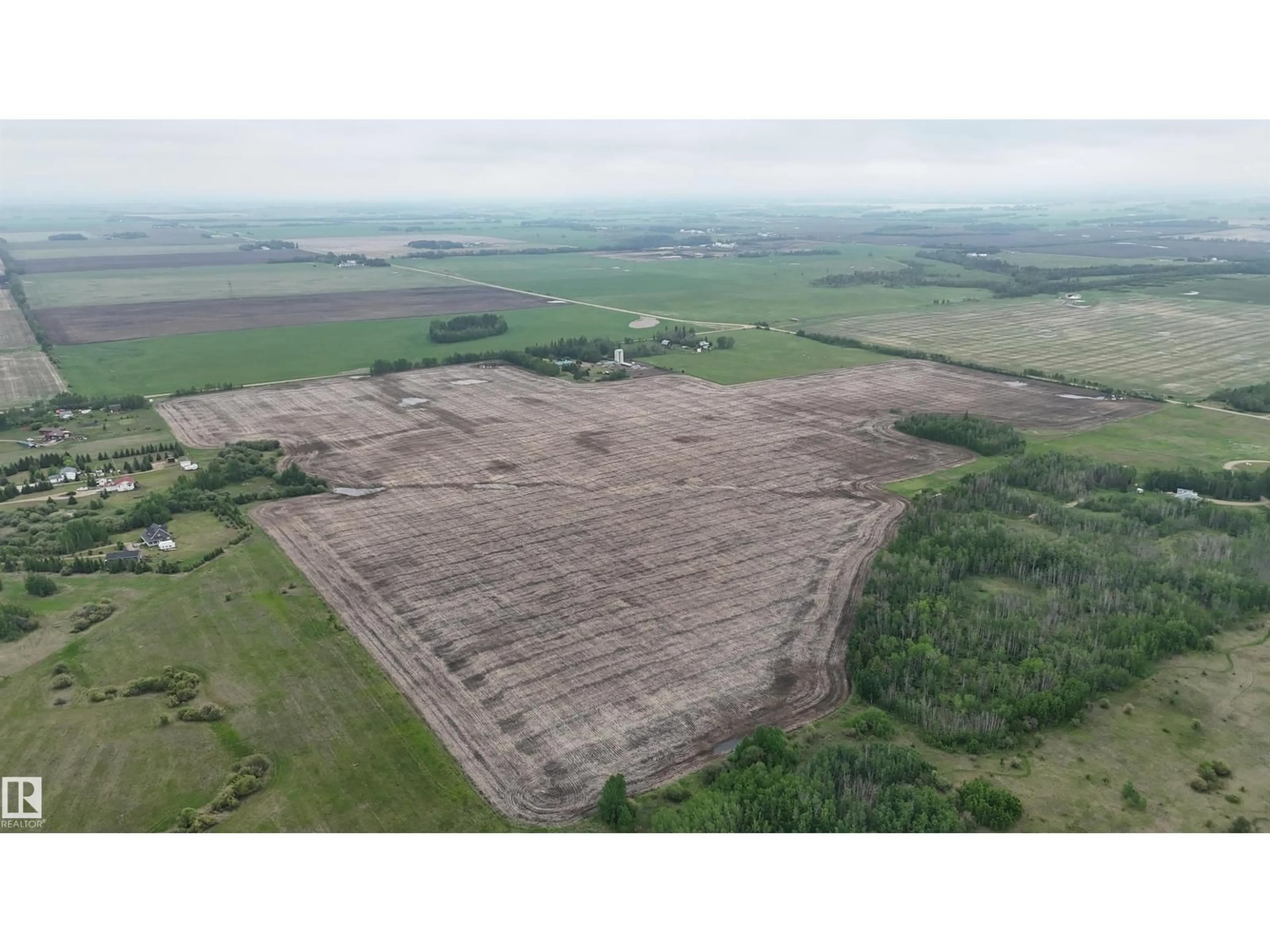 A pic from outside/outdoor area/front of a property/back of a property/a pic from drone, building for 1307 TWP ROAD 510, Rural Parkland County Alberta T7Y2N2
