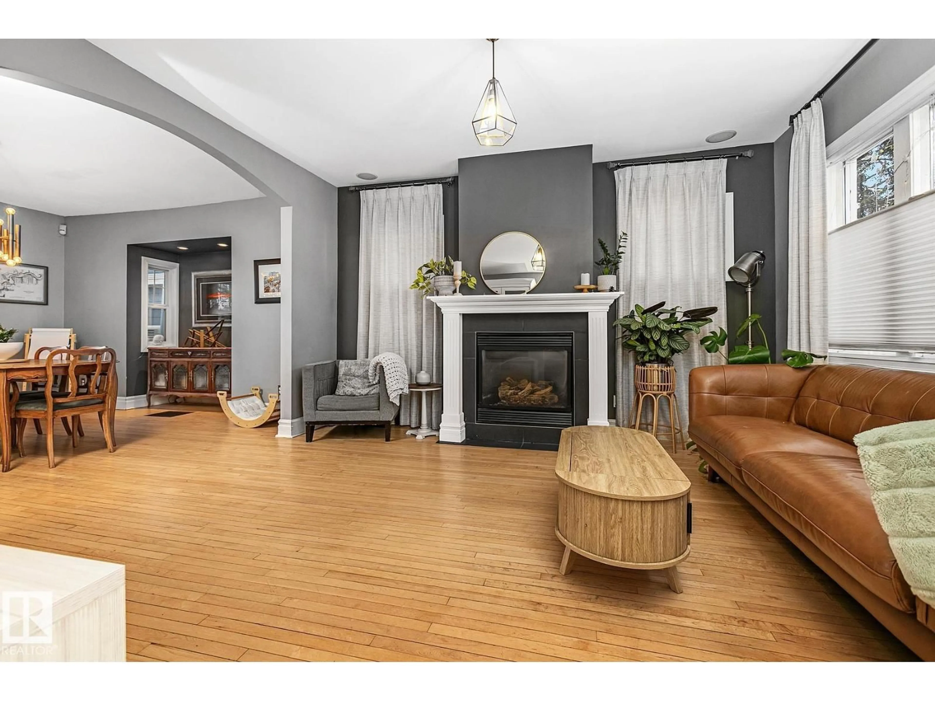 Living room with furniture, wood/laminate floor for 10823 125 ST, Edmonton Alberta T5M0L5