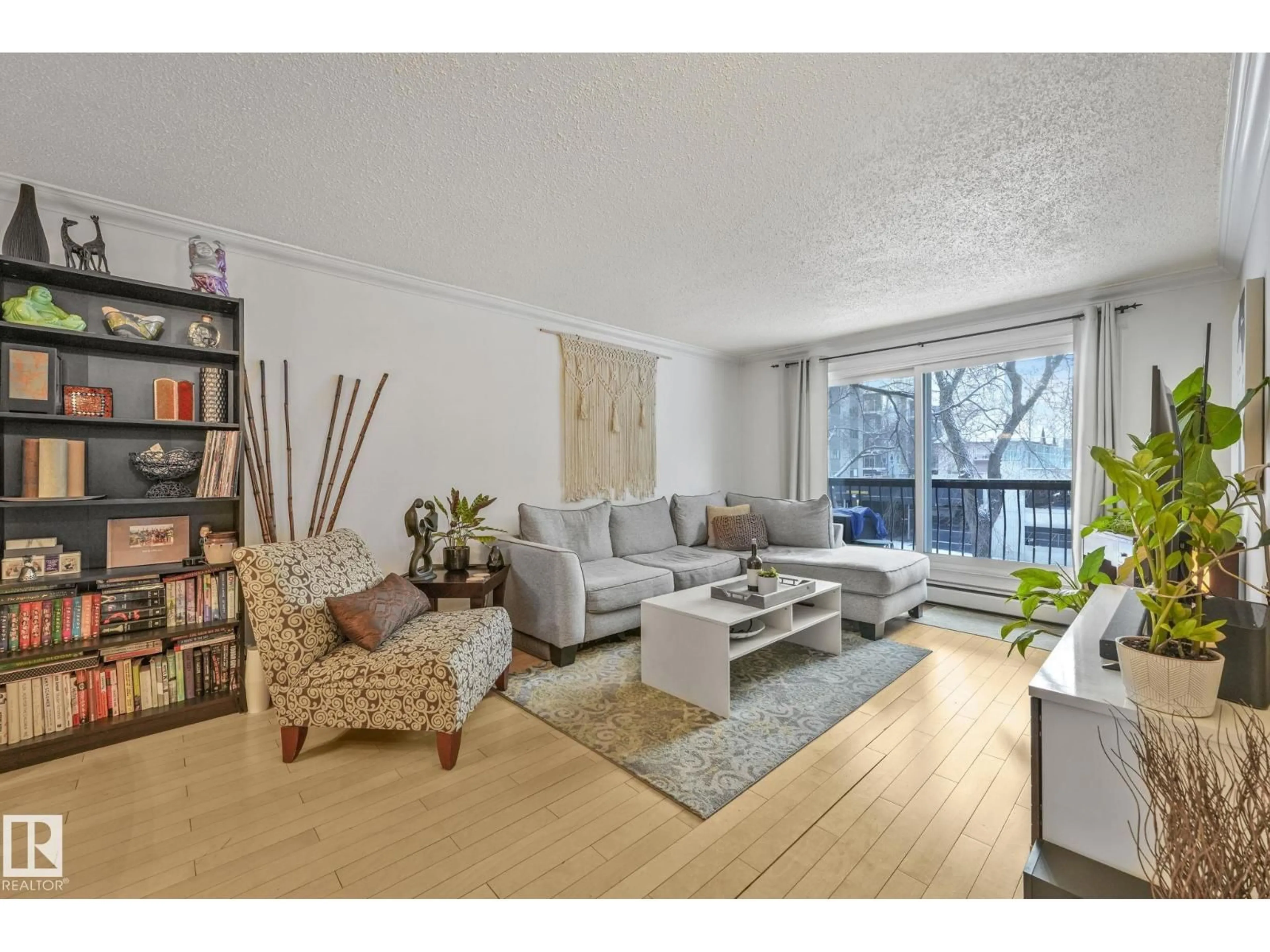 Living room with furniture, wood/laminate floor for #303 - 10165 113 ST, Edmonton Alberta T5K1P1