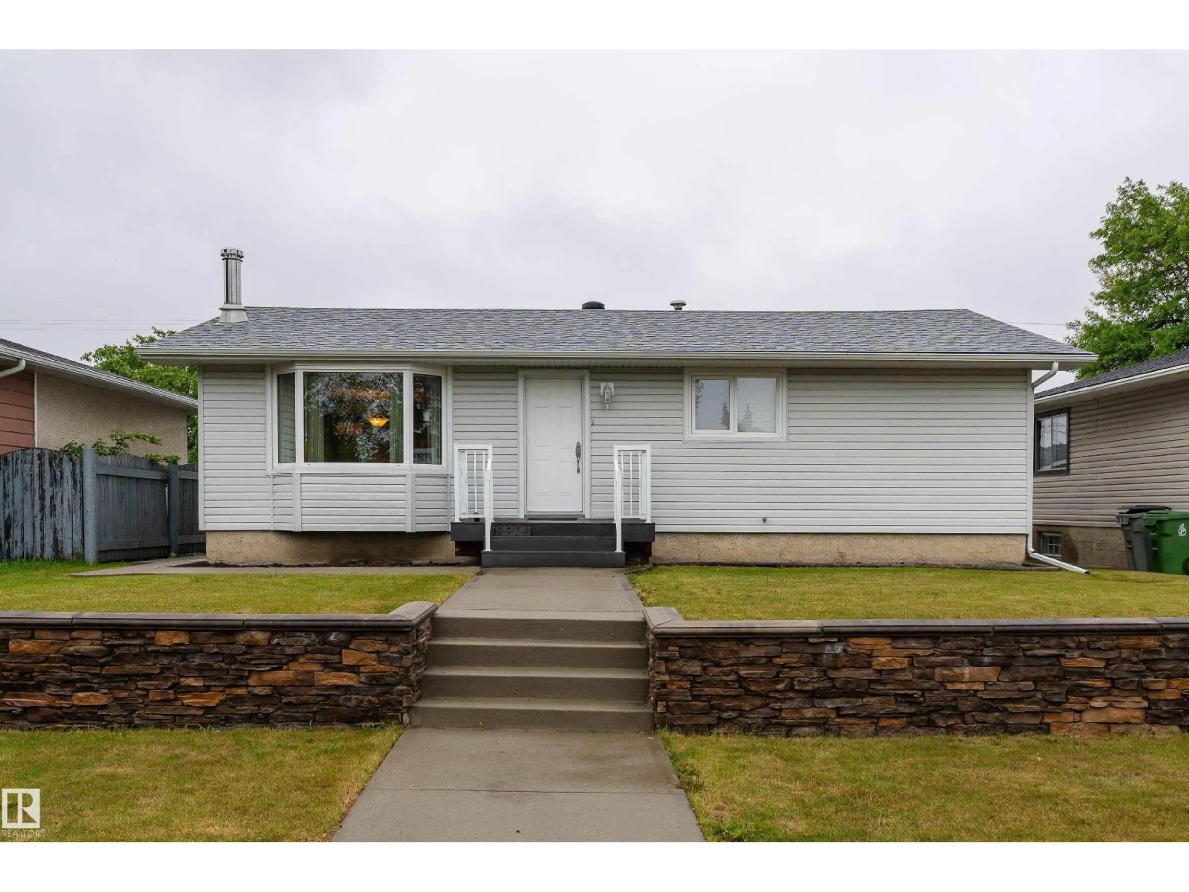 Home with vinyl exterior material, street for 9906 99 ST, Morinville Alberta T8R1G5