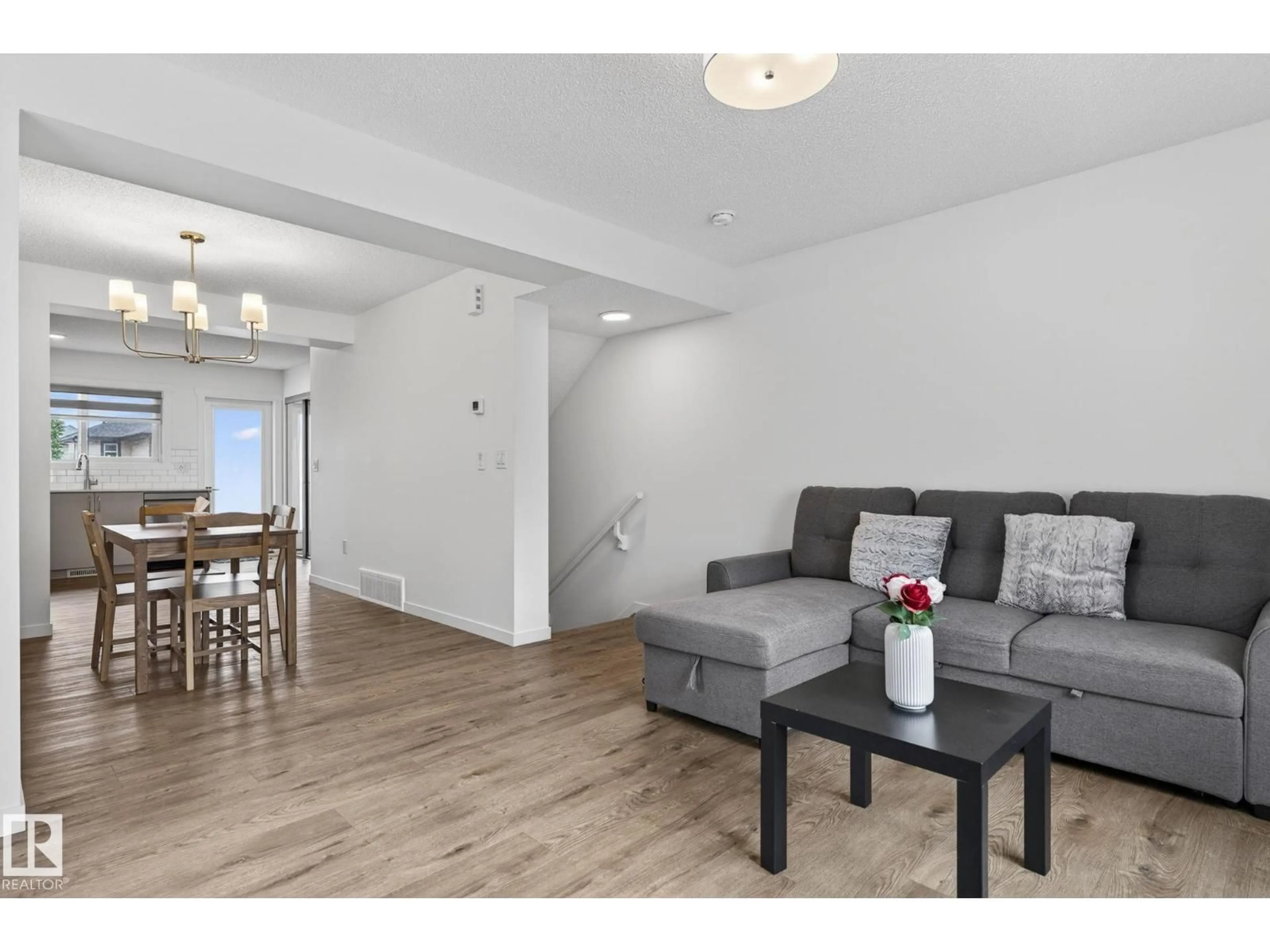 Living room with furniture, wood/laminate floor for #44 - 1025 SECORD PROMENADE PM, Edmonton Alberta T5T4A4