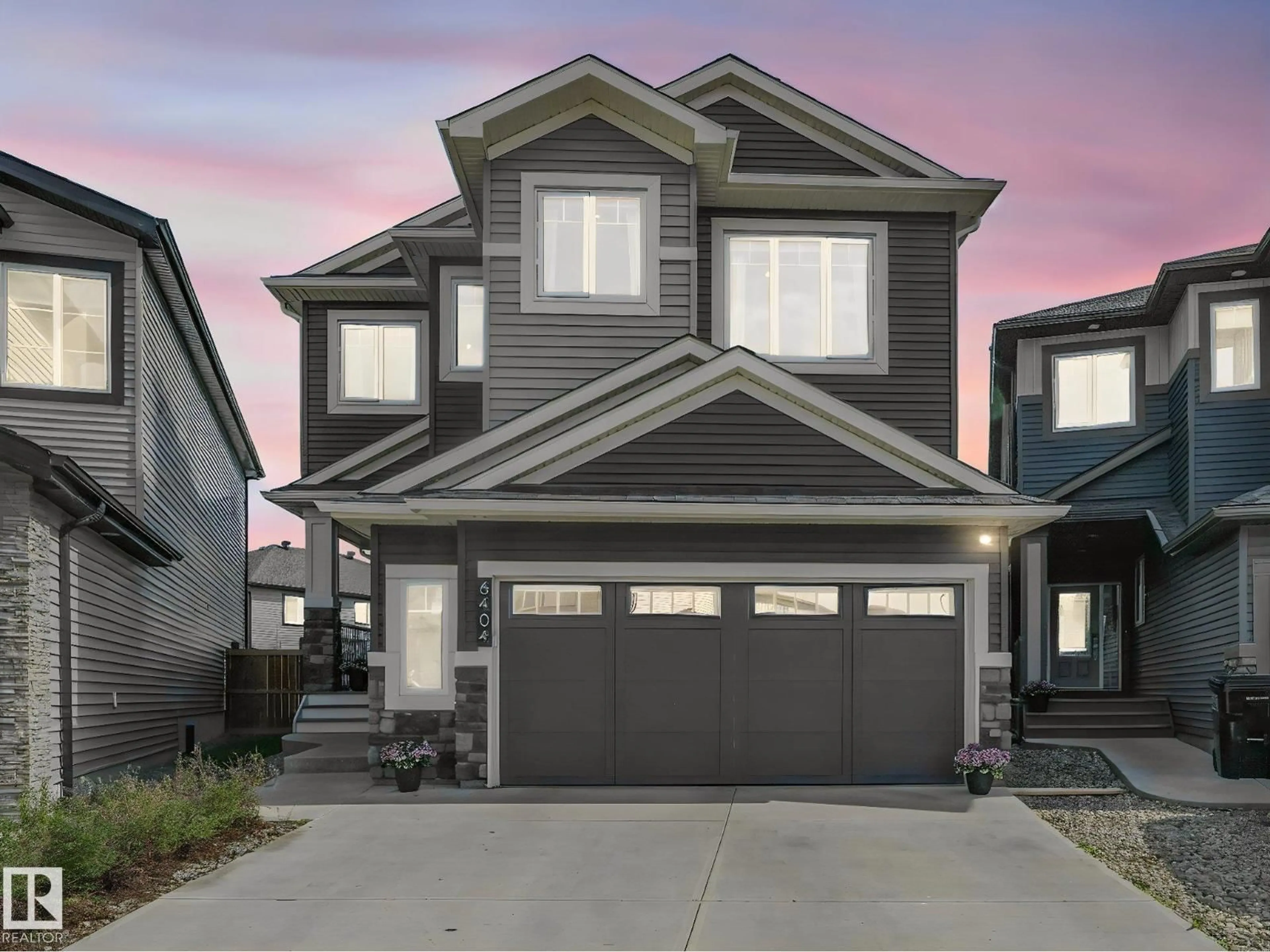 Home with vinyl exterior material, street for 6404 176 AV, Edmonton Alberta T5Y4A9