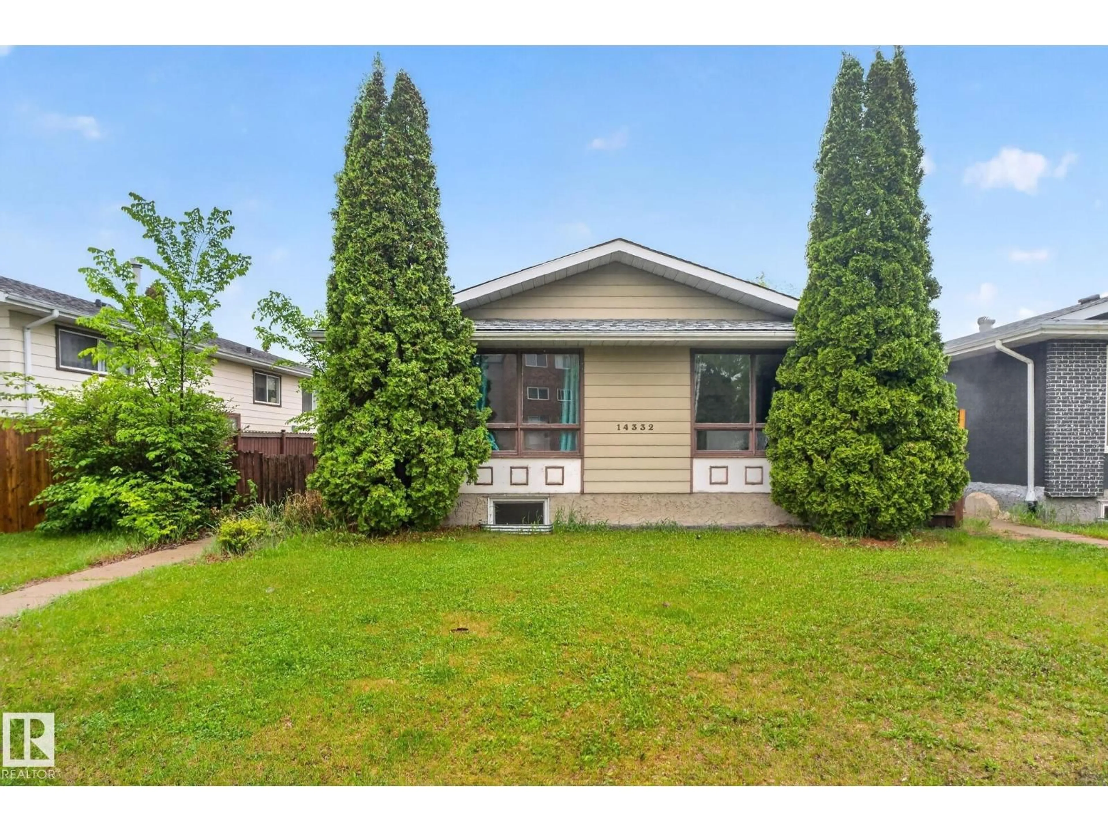 Home with vinyl exterior material, street for NW - 14332 121 ST, Edmonton Alberta T5X3P7