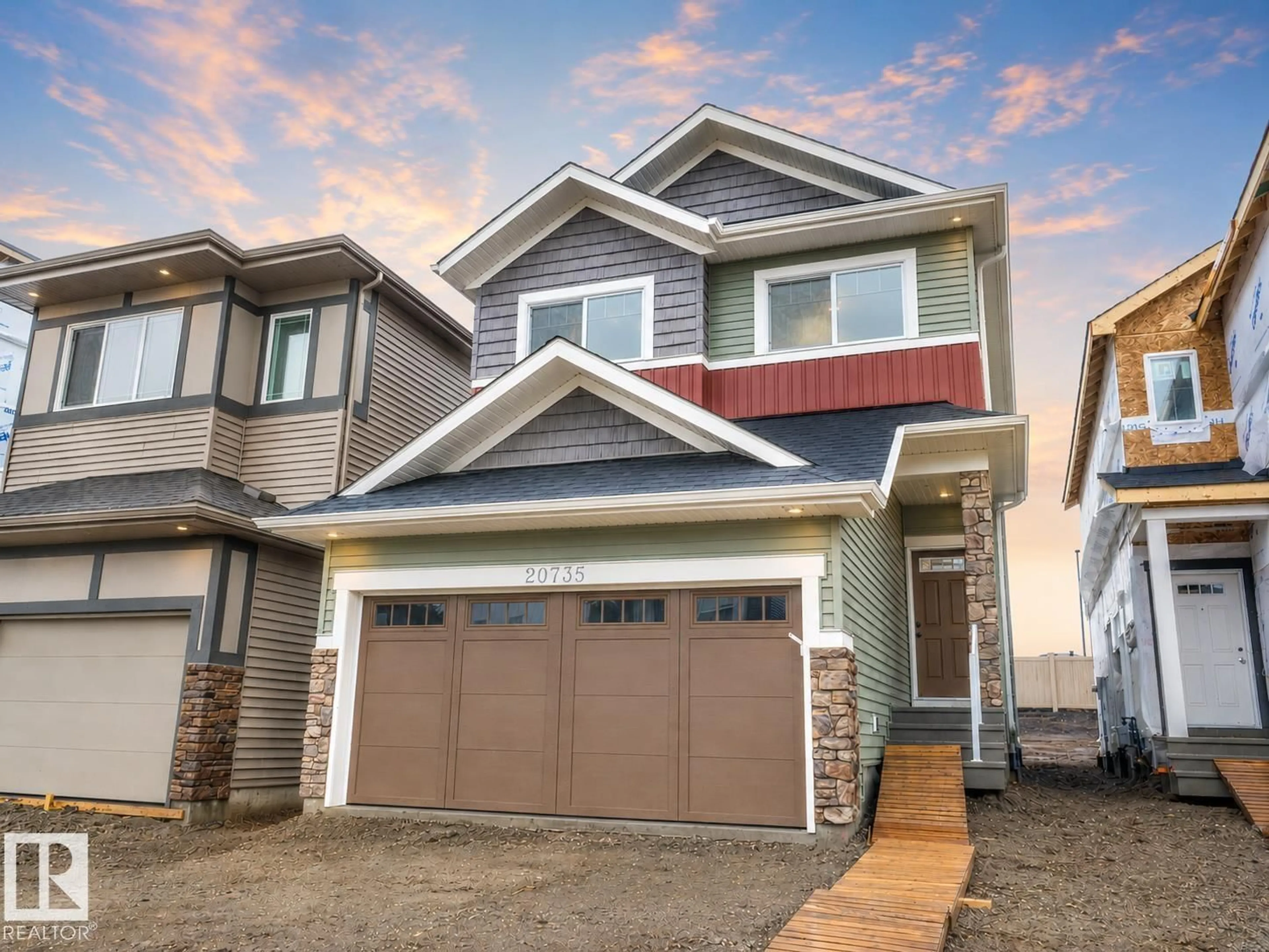 Home with vinyl exterior material, street for 20735 24 AV, Edmonton Alberta T6M2C4