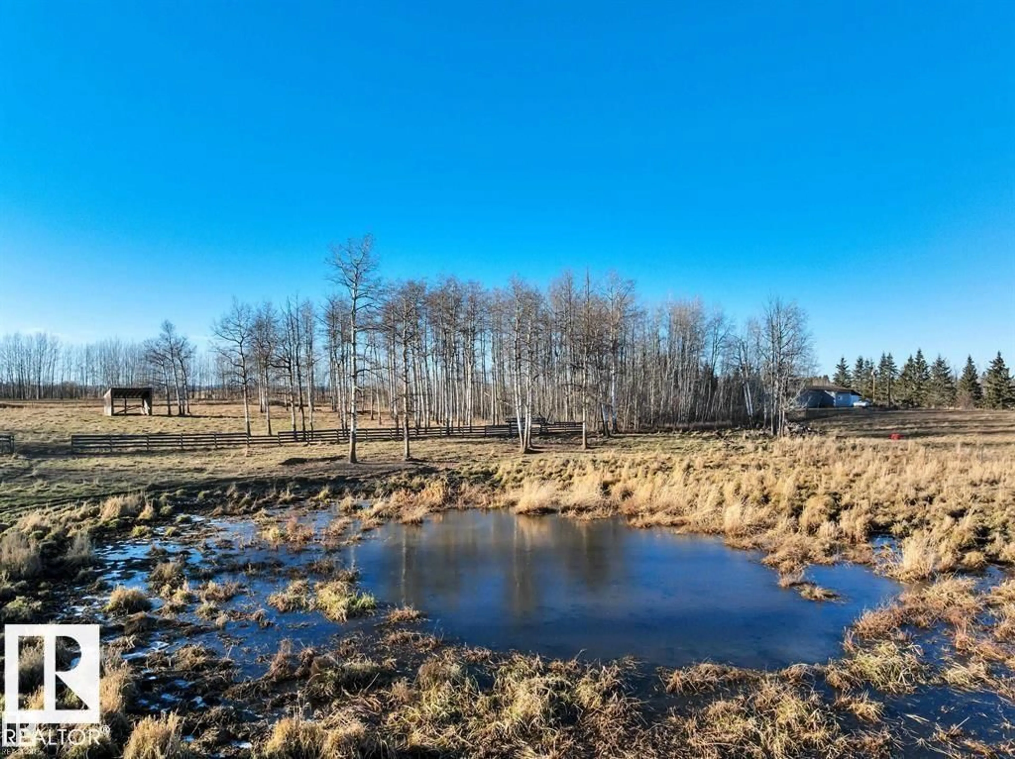 A pic from outside/outdoor area/front of a property/back of a property/a pic from drone, water/lake/river/ocean view for 465051 RGE ROAD 41, Rural Wetaskiwin County Alberta T0C2X0