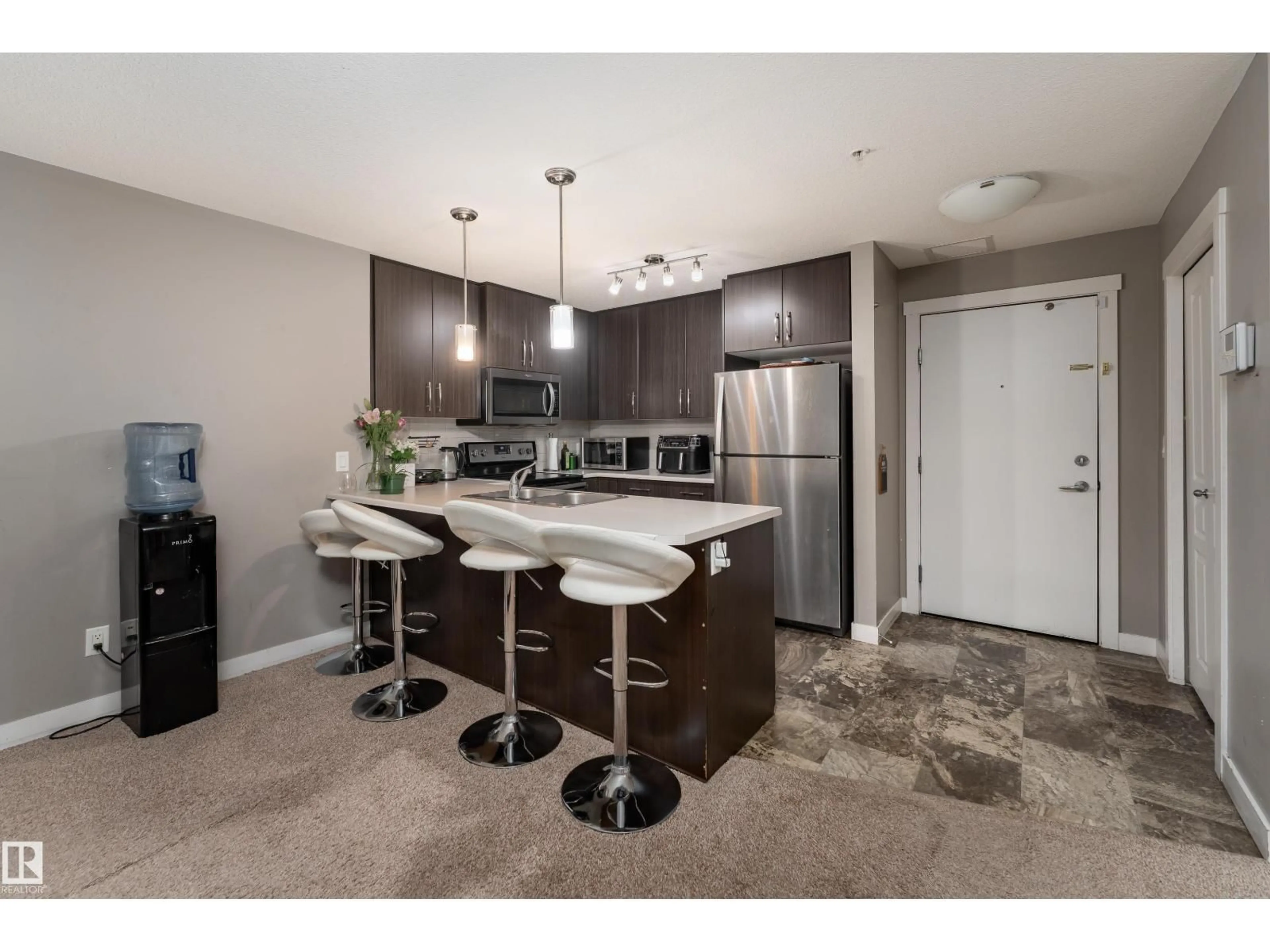 Open concept kitchen, unknown for #115 - 3670 139 AV NW, Edmonton Alberta T5Y3N5