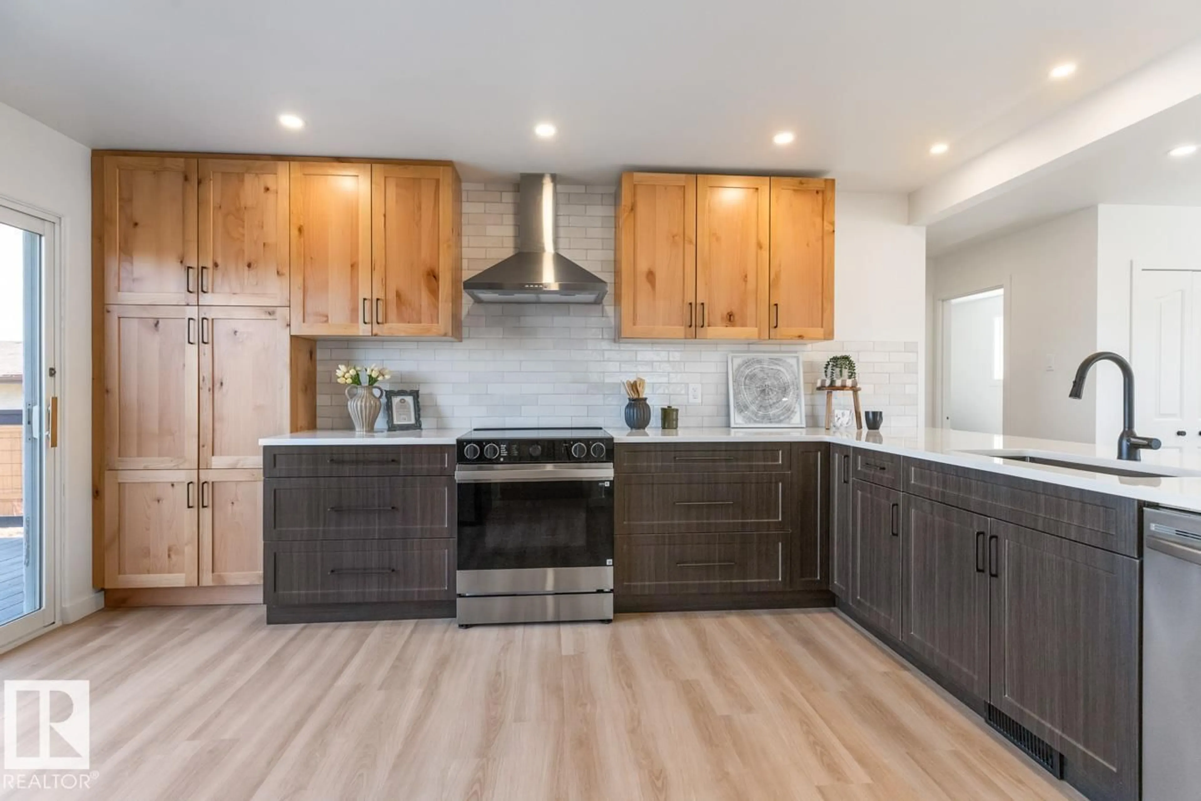 Open concept kitchen, wood/laminate floor for 4508 109A AV, Edmonton Alberta T6A1S4