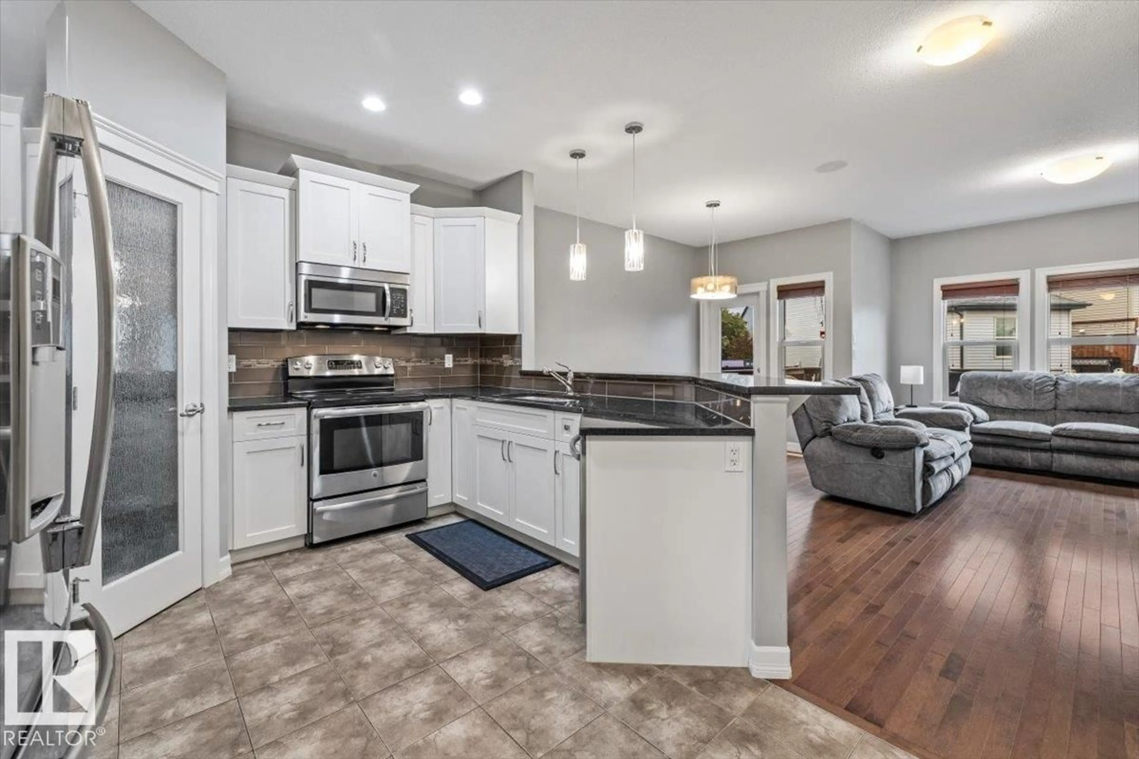 Open concept kitchen, ceramic/tile floor for 107 GILMORE WY, Spruce Grove Alberta T7X0M5
