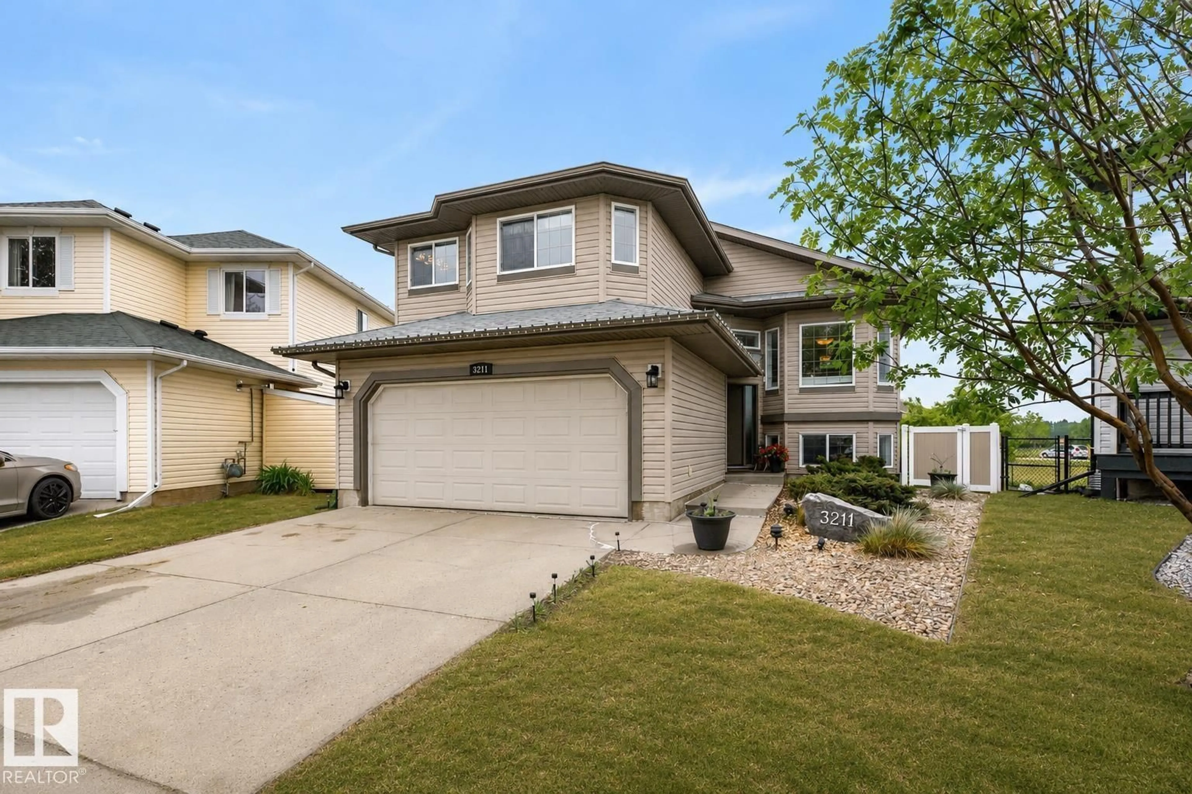 Home with vinyl exterior material, street for 3211 47 ST, Beaumont Alberta T4X0B7