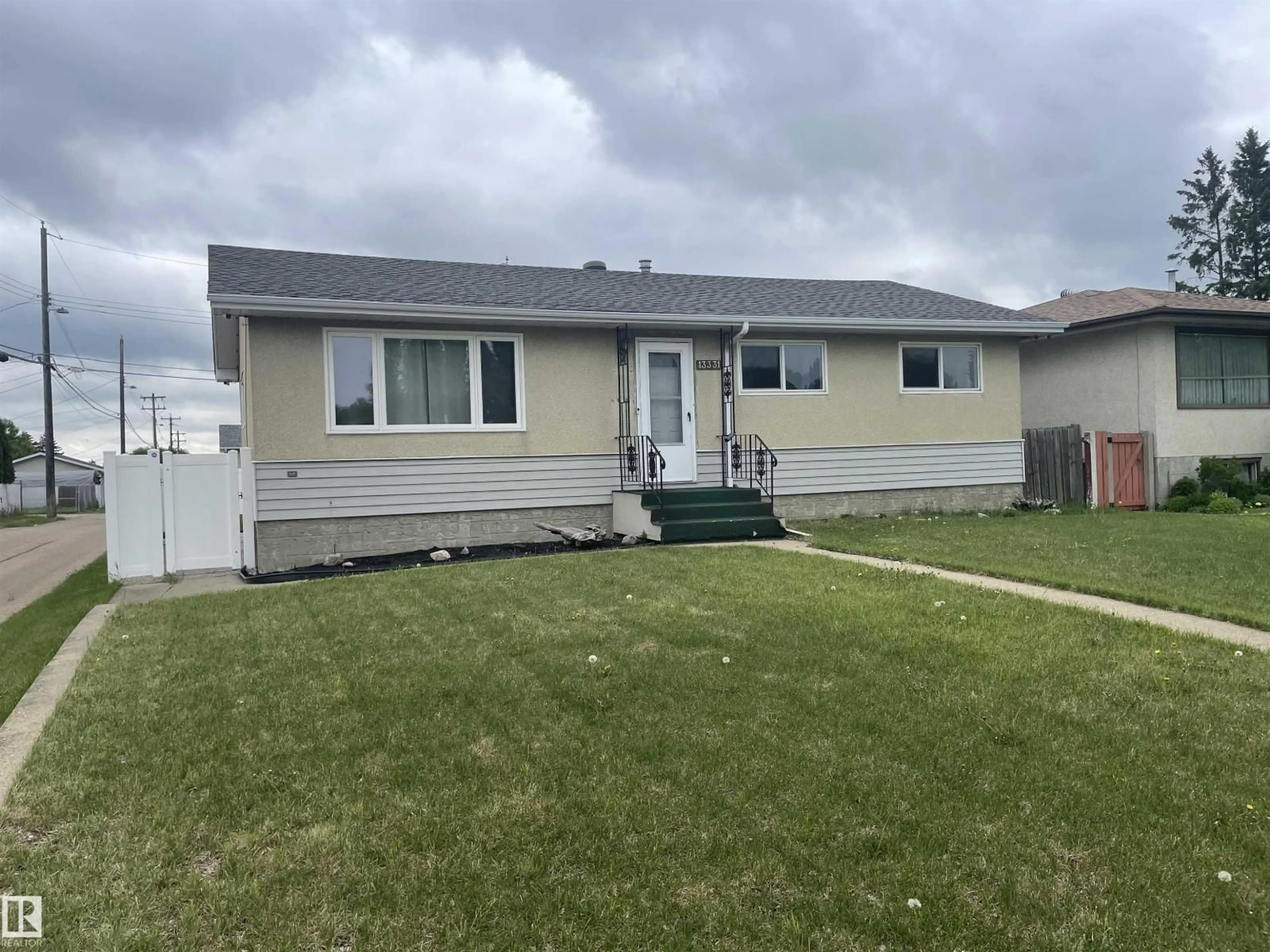 Home with vinyl exterior material, street for 13331 64 ST, Edmonton Alberta T5A0Y6