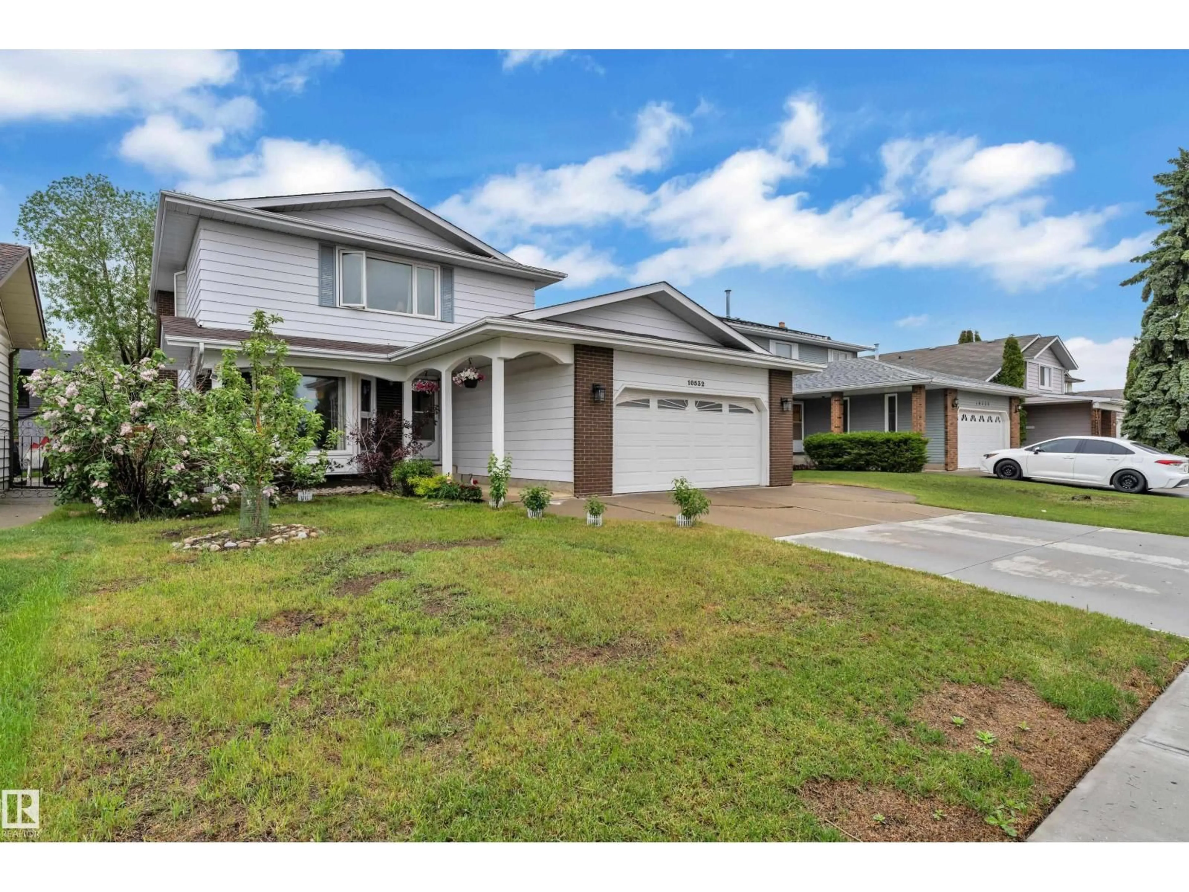 Home with vinyl exterior material, street for 10532 154 AV, Edmonton Alberta T5X5A9