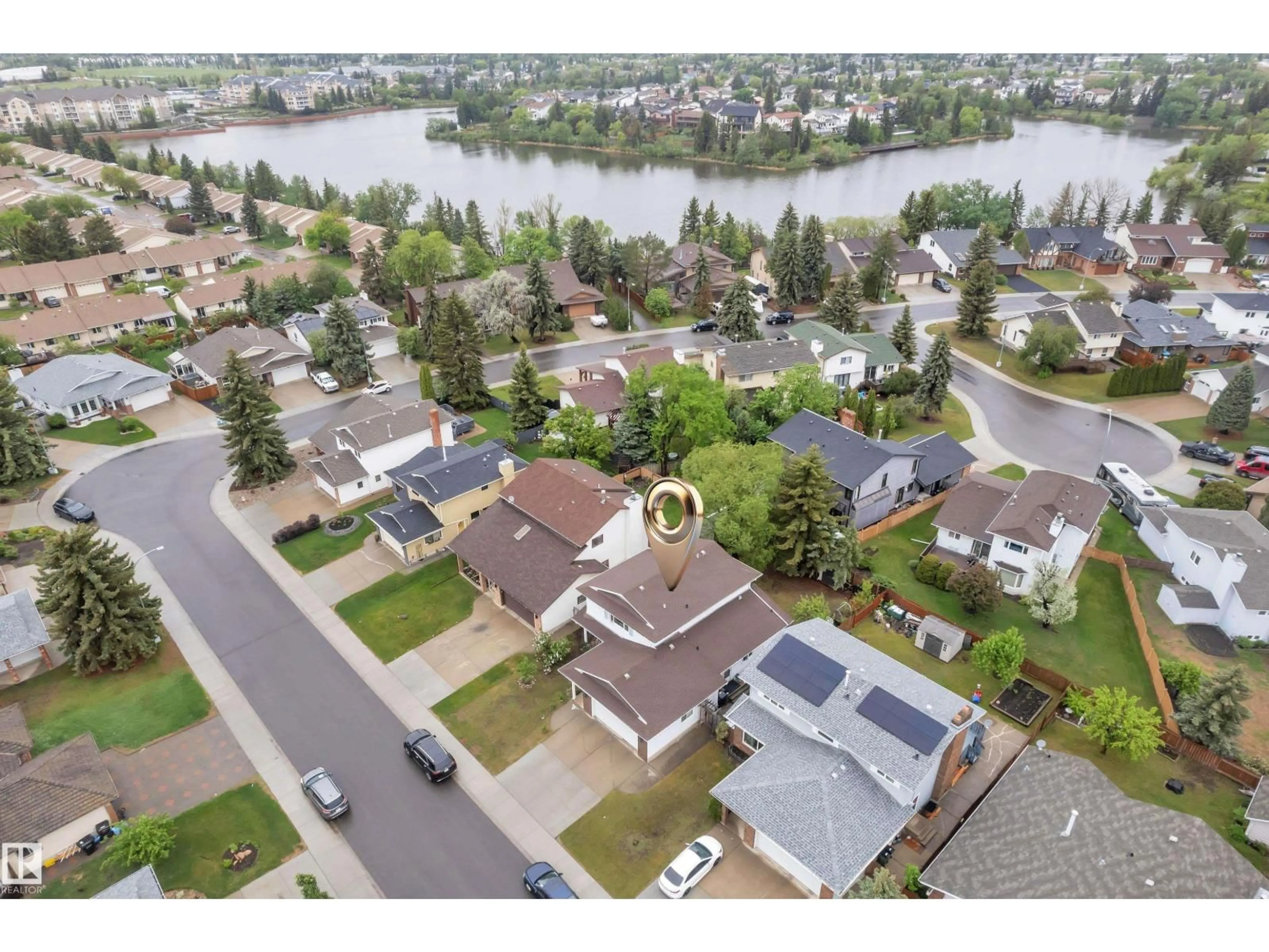 A pic from outside/outdoor area/front of a property/back of a property/a pic from drone, water/lake/river/ocean view for 10532 154 AV, Edmonton Alberta T5X5A9