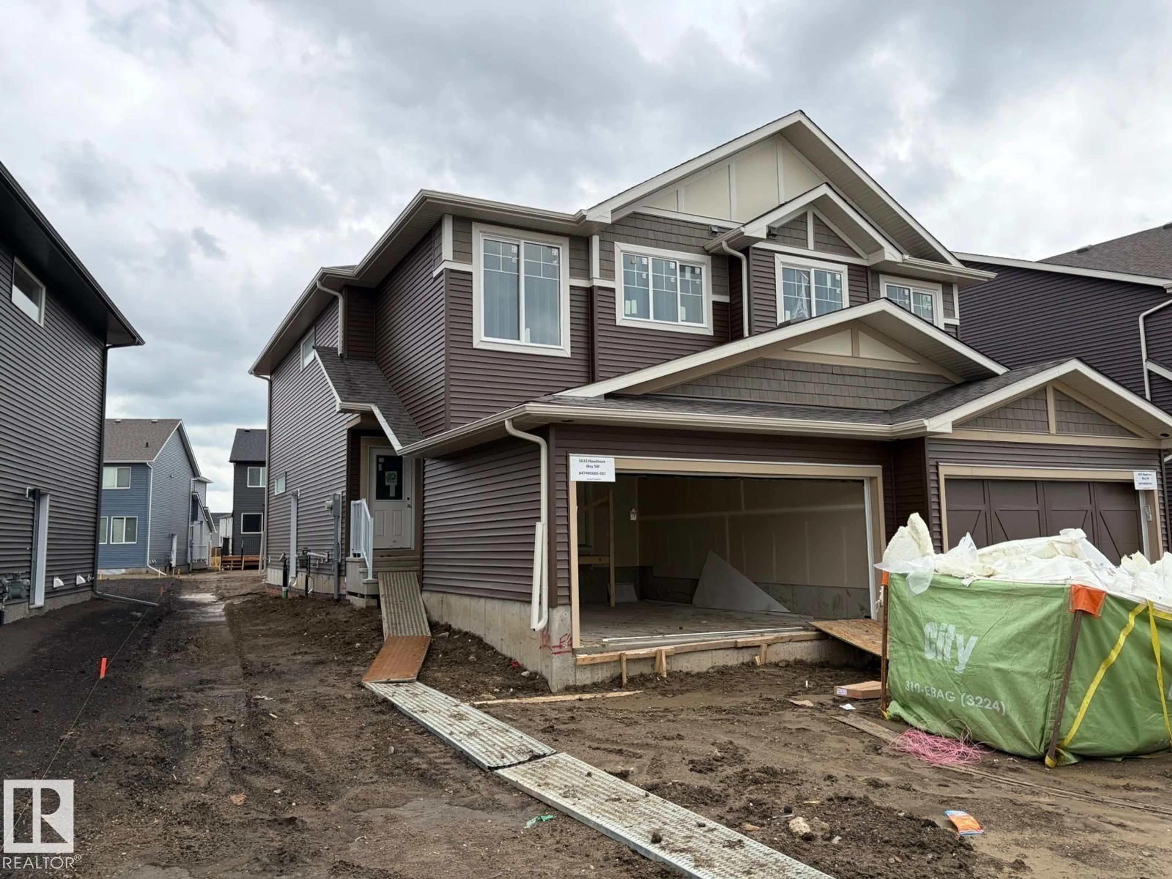 Home with vinyl exterior material, street for SW - 5633 HAWTHORN WY, Edmonton Alberta T6X3K7