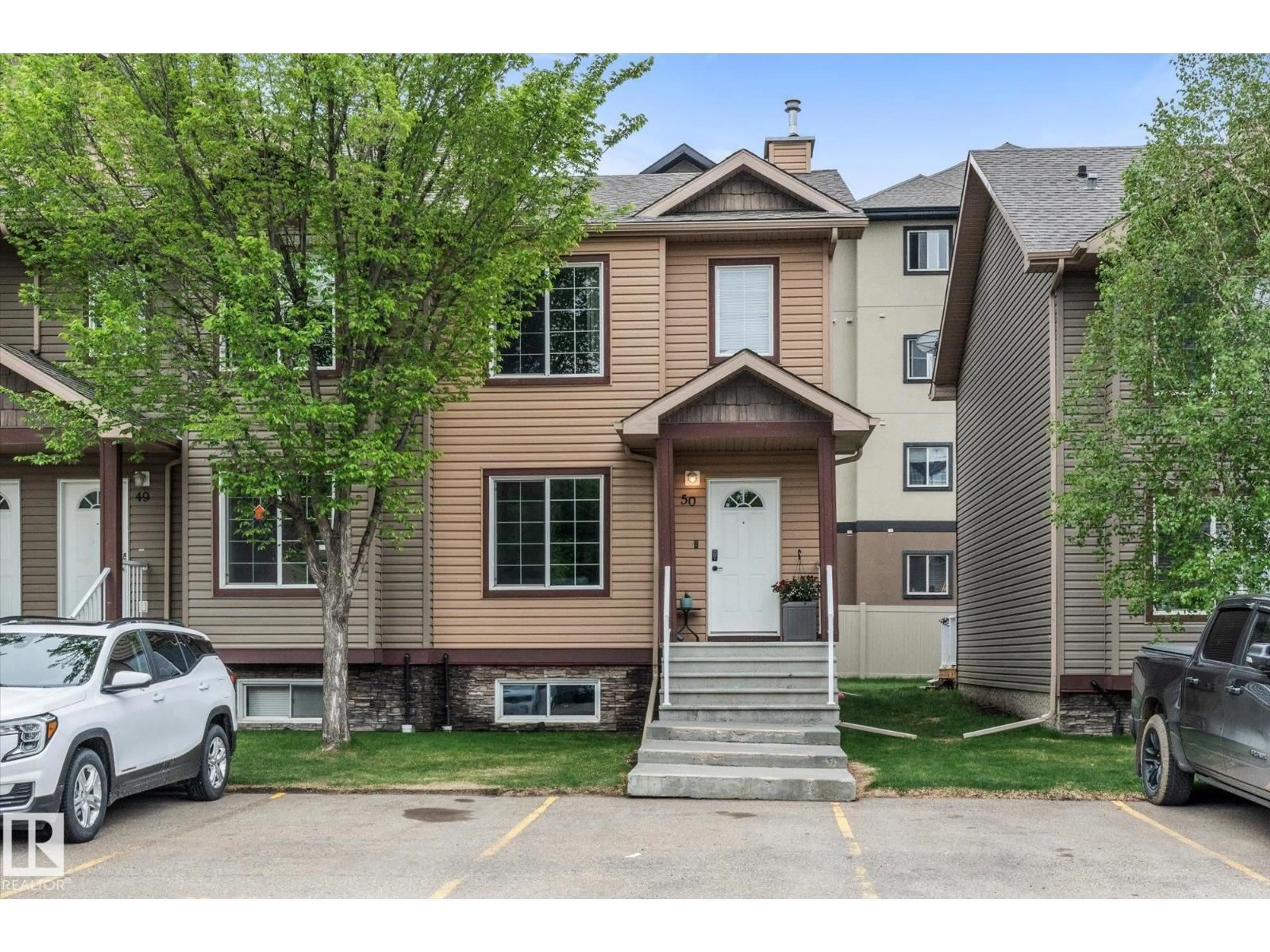 Home with vinyl exterior material, street for 50 320 SPRUCE RIDGE RD, Spruce Grove Alberta T7X2Z3