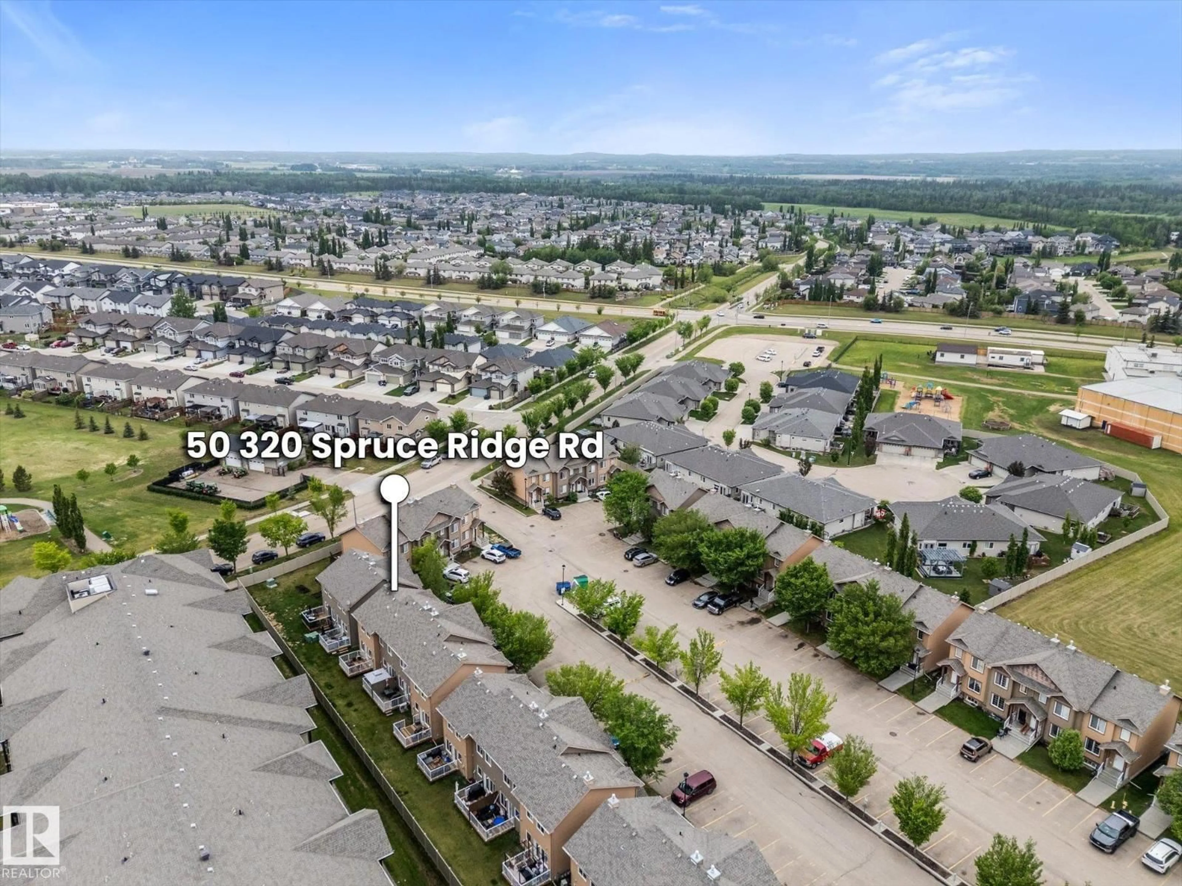 A pic from outside/outdoor area/front of a property/back of a property/a pic from drone, street for 50 320 SPRUCE RIDGE RD, Spruce Grove Alberta T7X2Z3