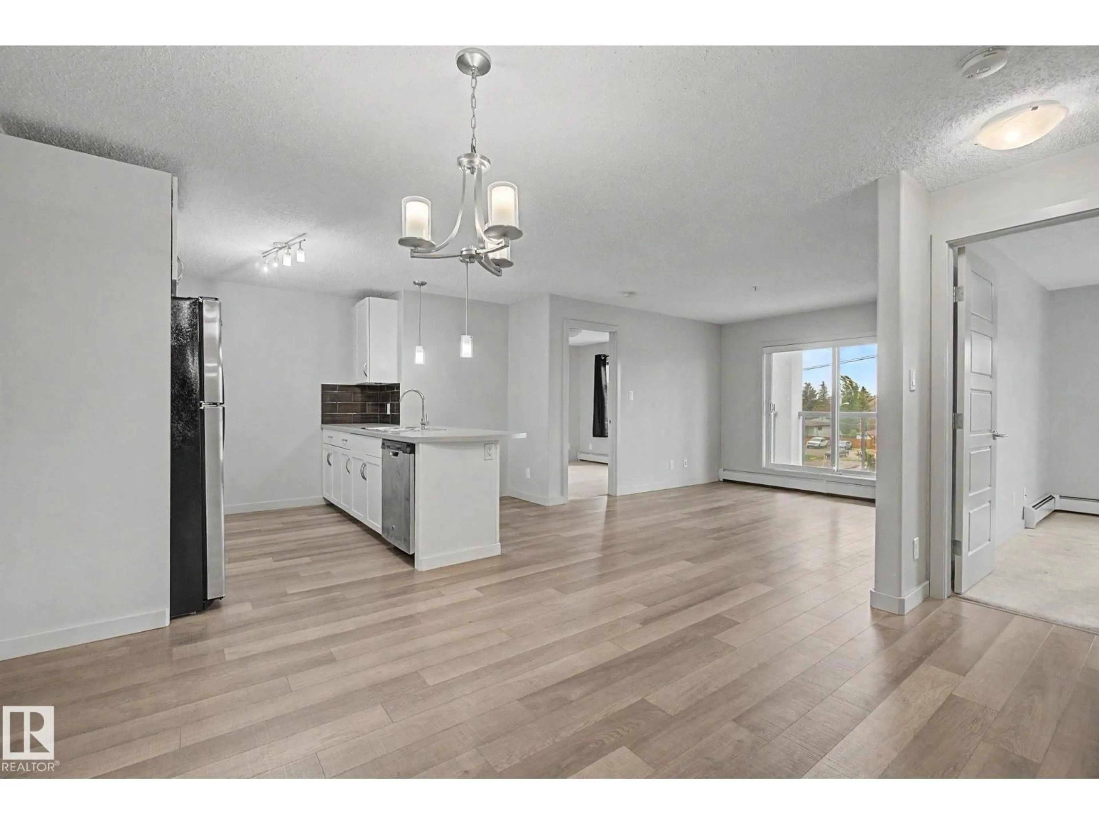 Open concept kitchen, wood/laminate floor for 359 7805 71 ST NW, Edmonton Alberta T6B3V6