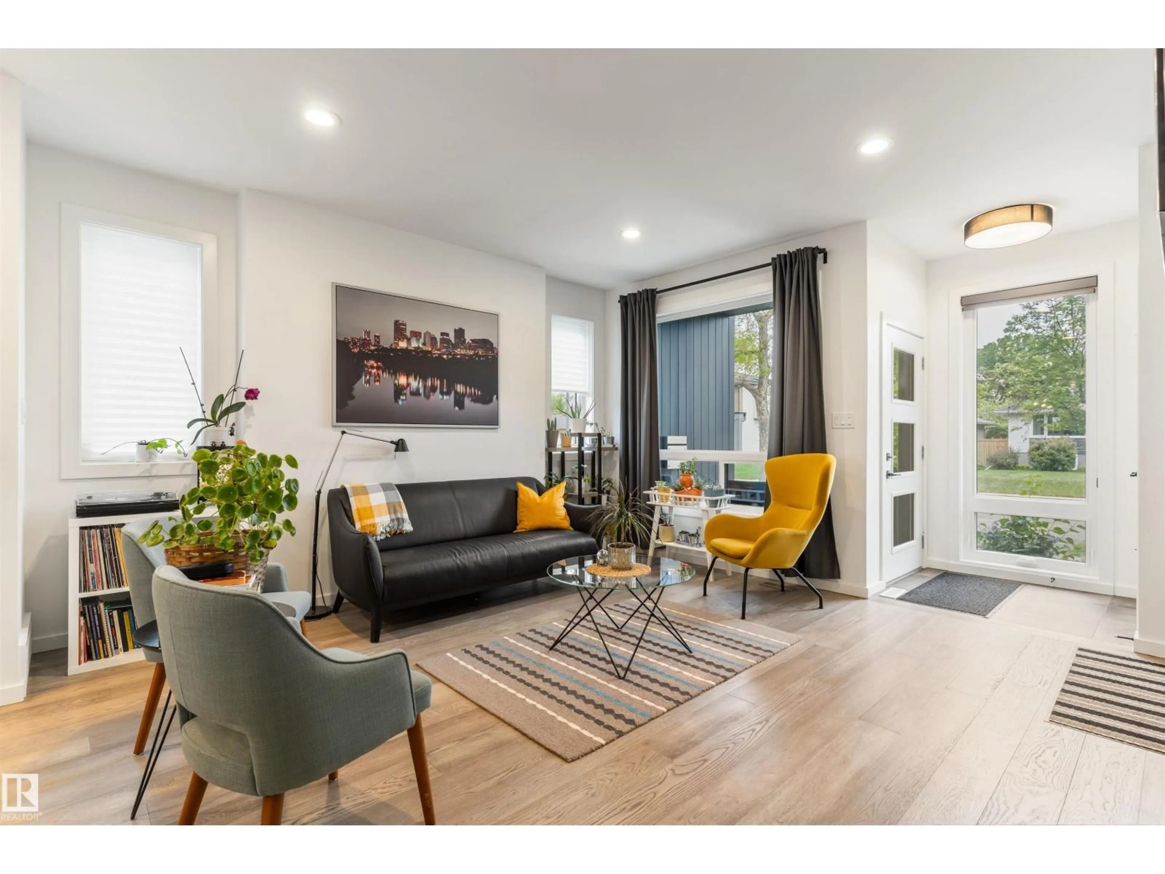 Living room with furniture, wood/laminate floor for 9124 73 AV, Edmonton Alberta T6E1A6