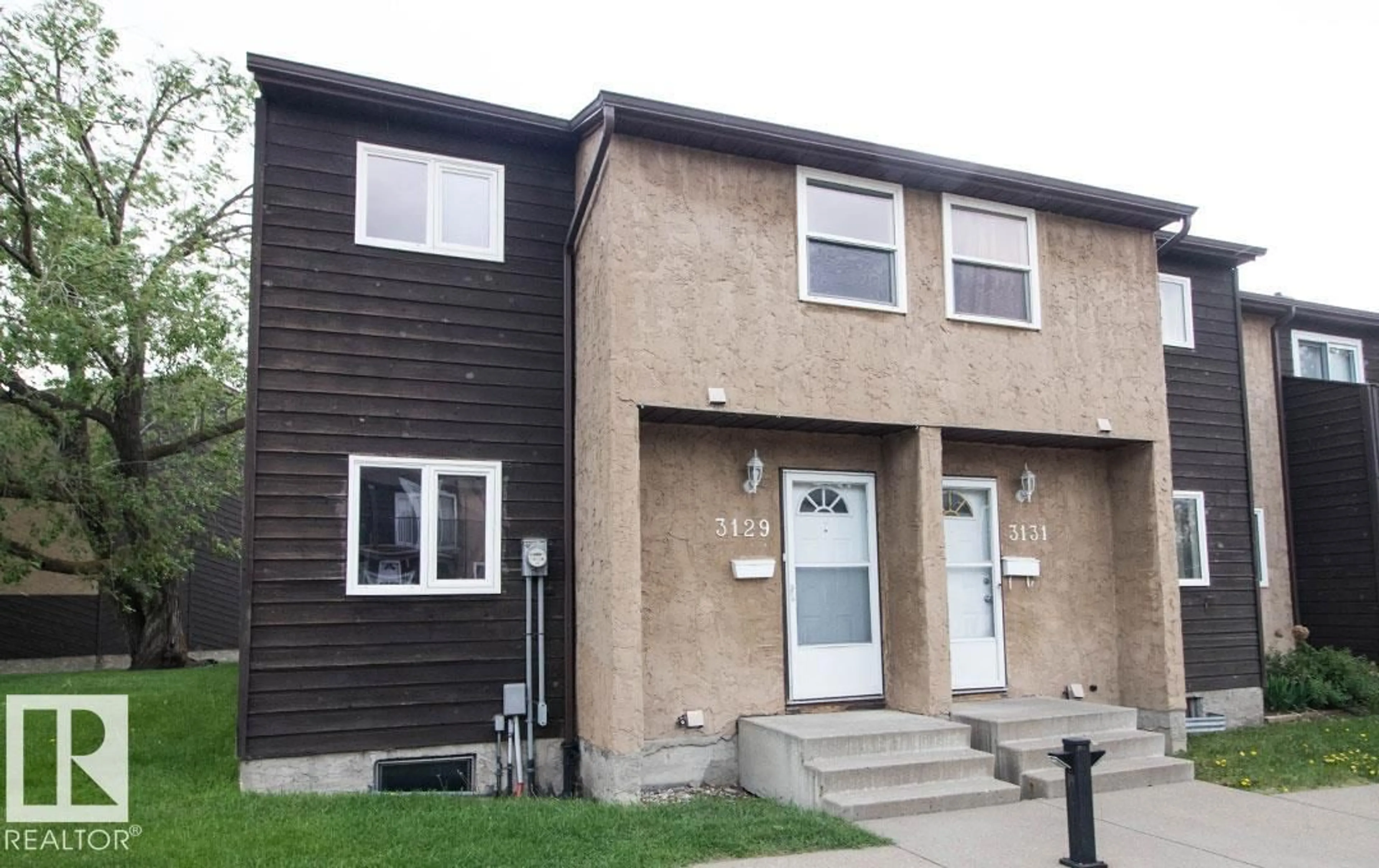 Home with vinyl exterior material, street for 3129 139 AV, Edmonton Alberta T5Y1R4