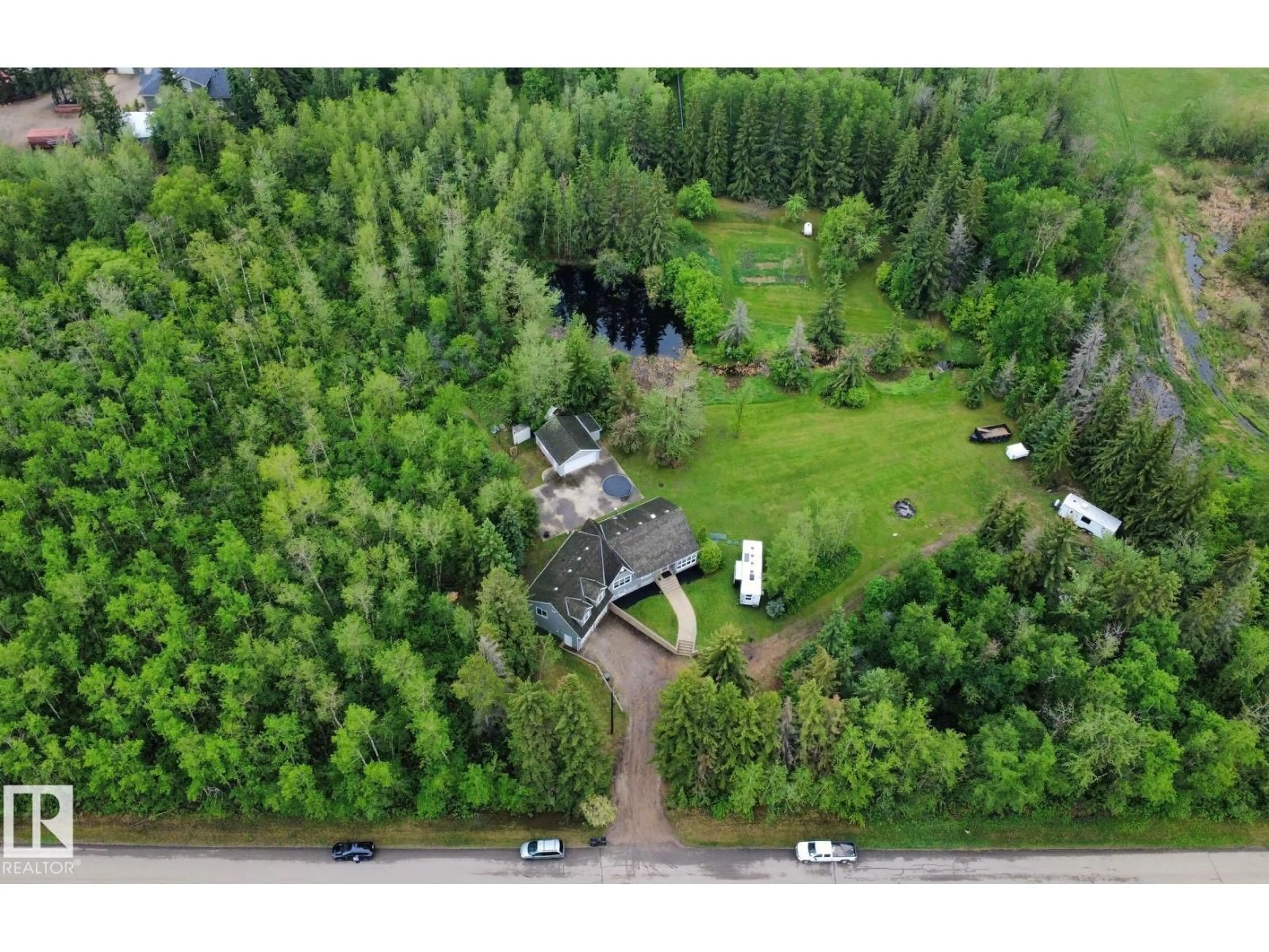 A pic from outside/outdoor area/front of a property/back of a property/a pic from drone, forest/trees view for 22560 - 121 WYE RD, Rural Strathcona County Alberta T8A4T6