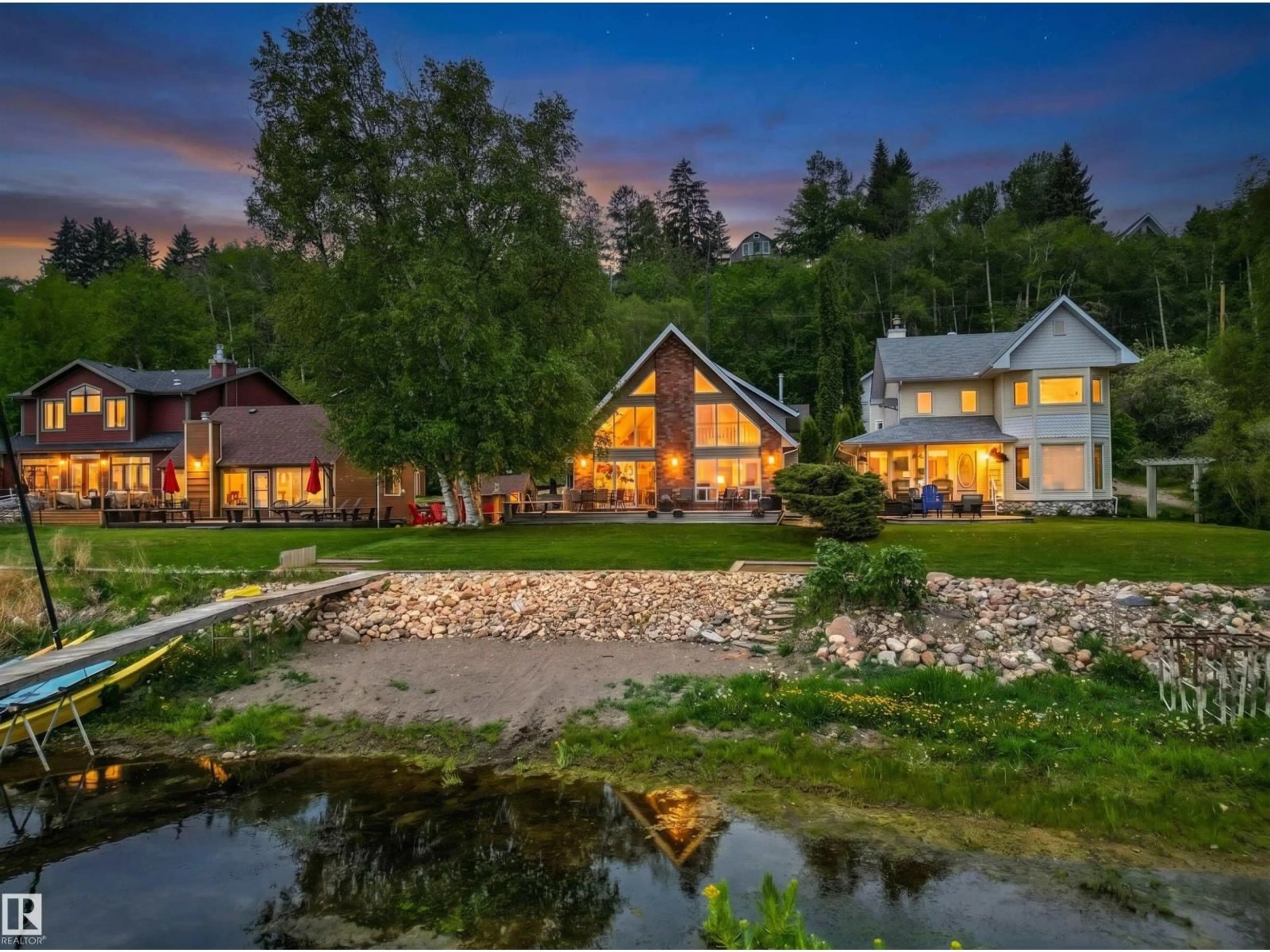 A pic from outside/outdoor area/front of a property/back of a property/a pic from drone, water/lake/river/ocean view for 597 1 AV, Rural Parkland County Alberta T0E2B0