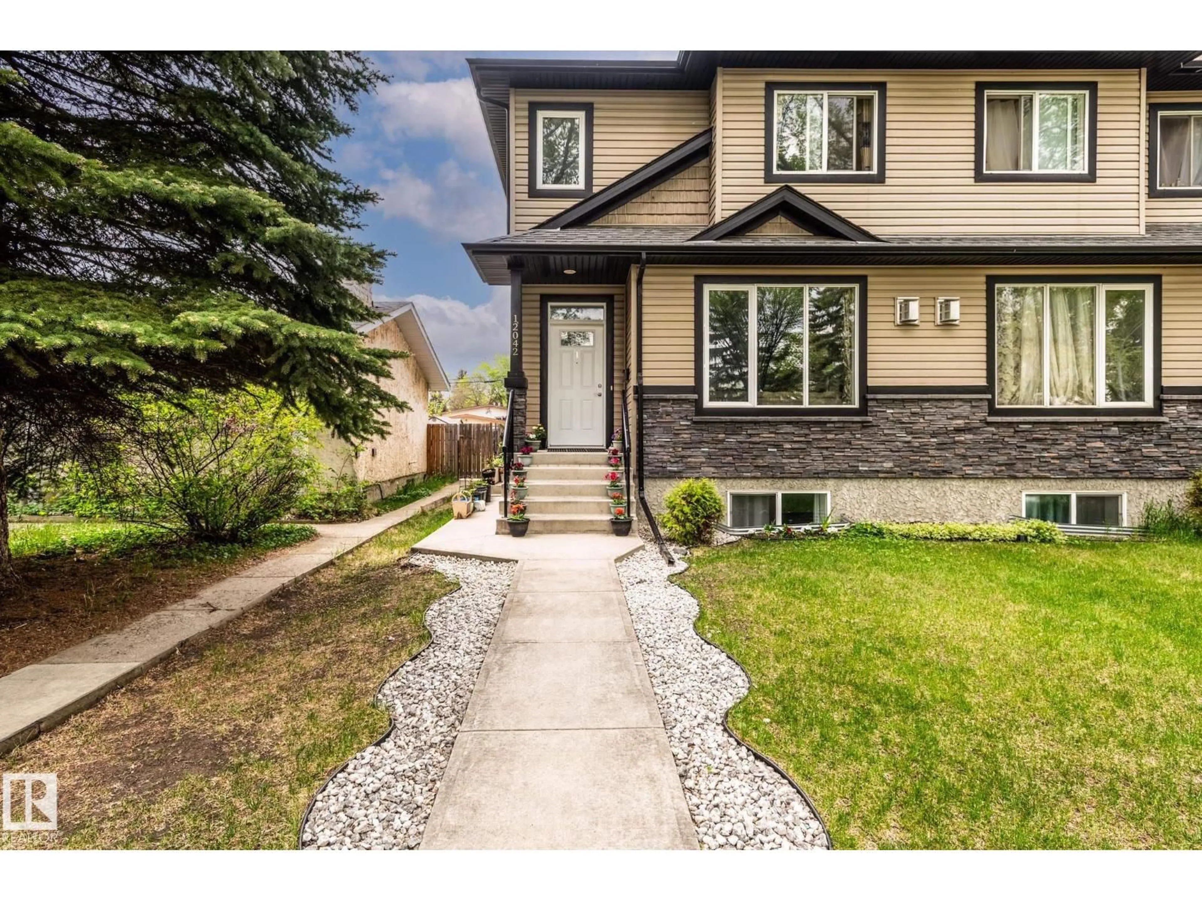 Home with vinyl exterior material, street for NW - 12042 101 ST, Edmonton Alberta T5G2C1