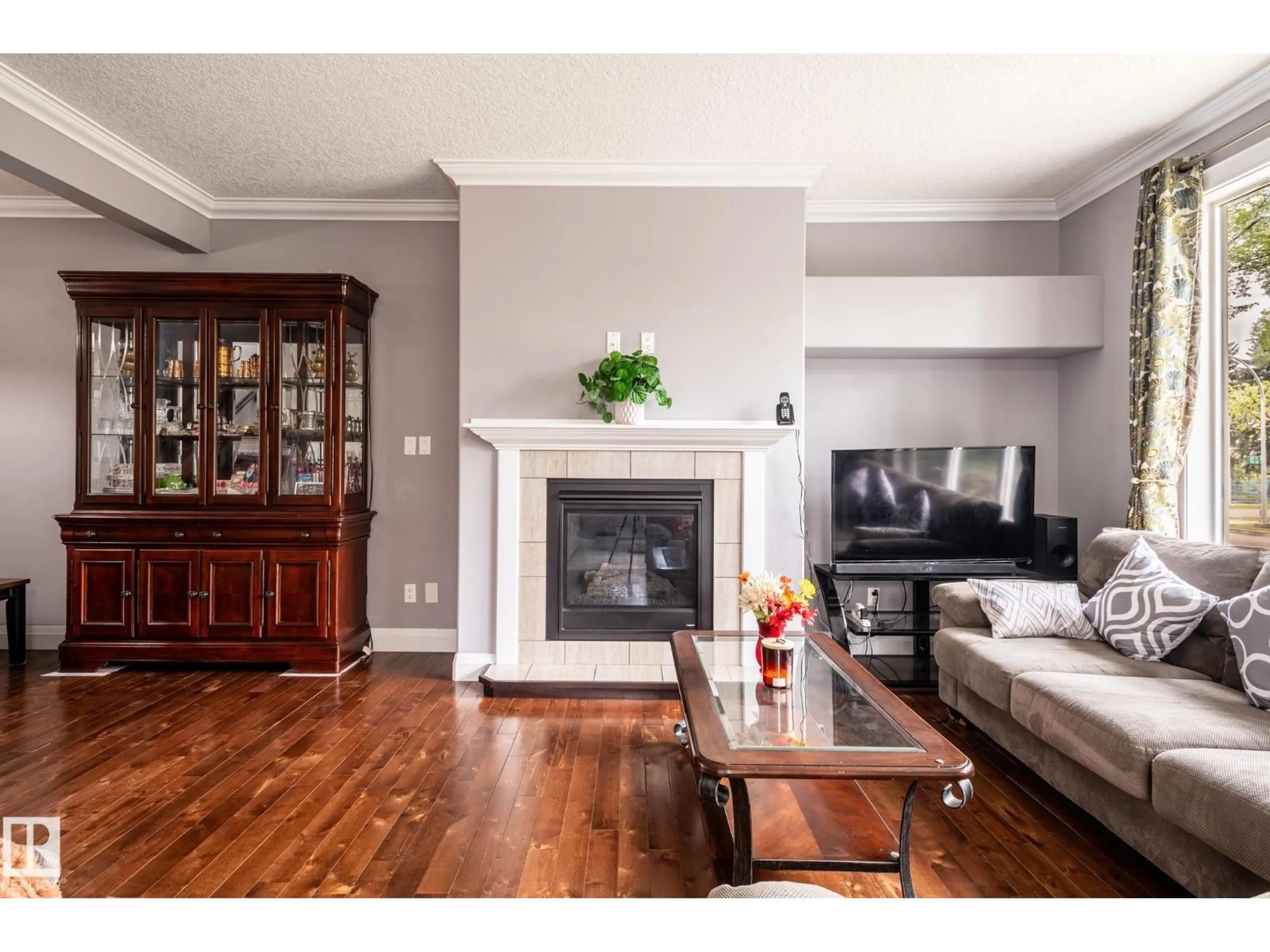 Living room with furniture, wood/laminate floor for NW - 12042 101 ST, Edmonton Alberta T5G2C1